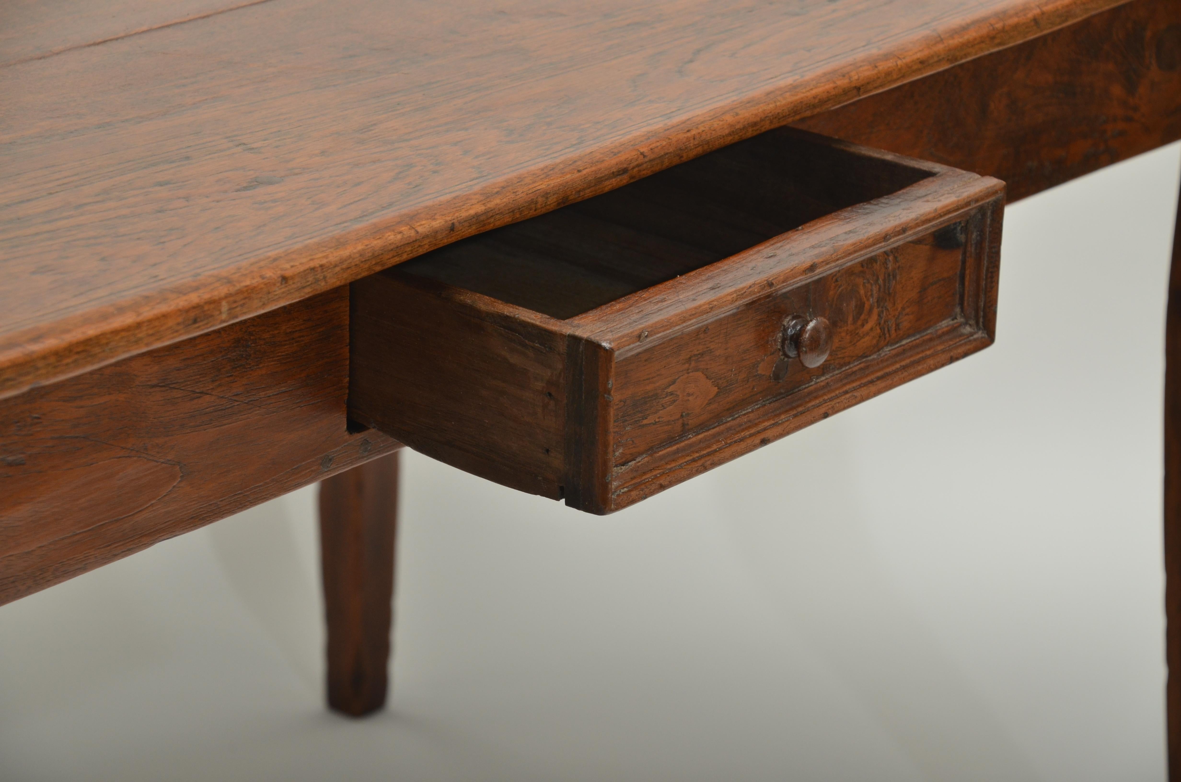 Three-plank top table with single drawer, square tapered scratch molded legs, peg construction.
 