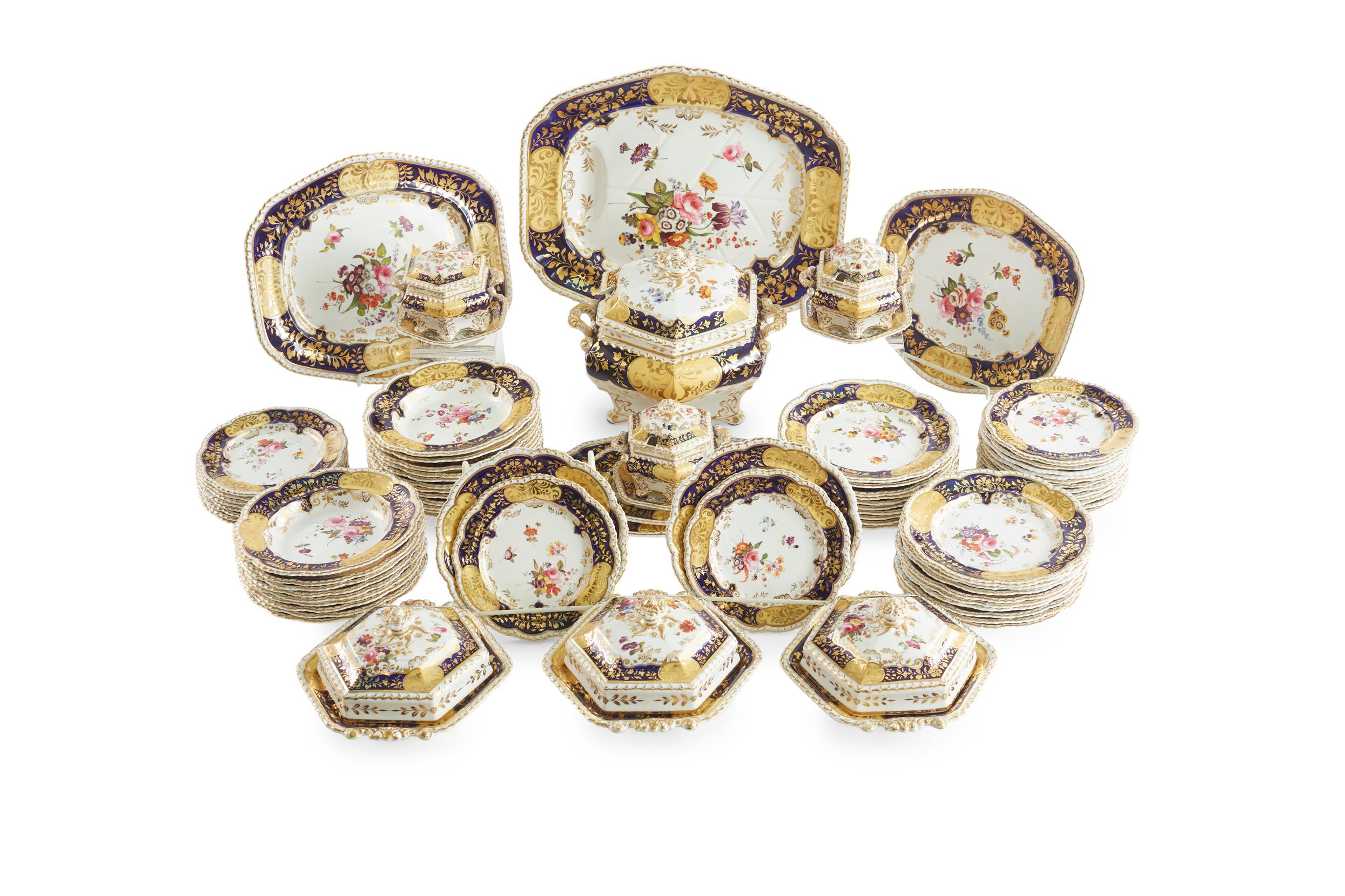 Mid 19th Century British porcelain dinnerware service with hand painted gilt foliate borders with bouquets of wild flowers against a white background design details. Each piece is in great antique condition. Minor wear consistent with age / use.
