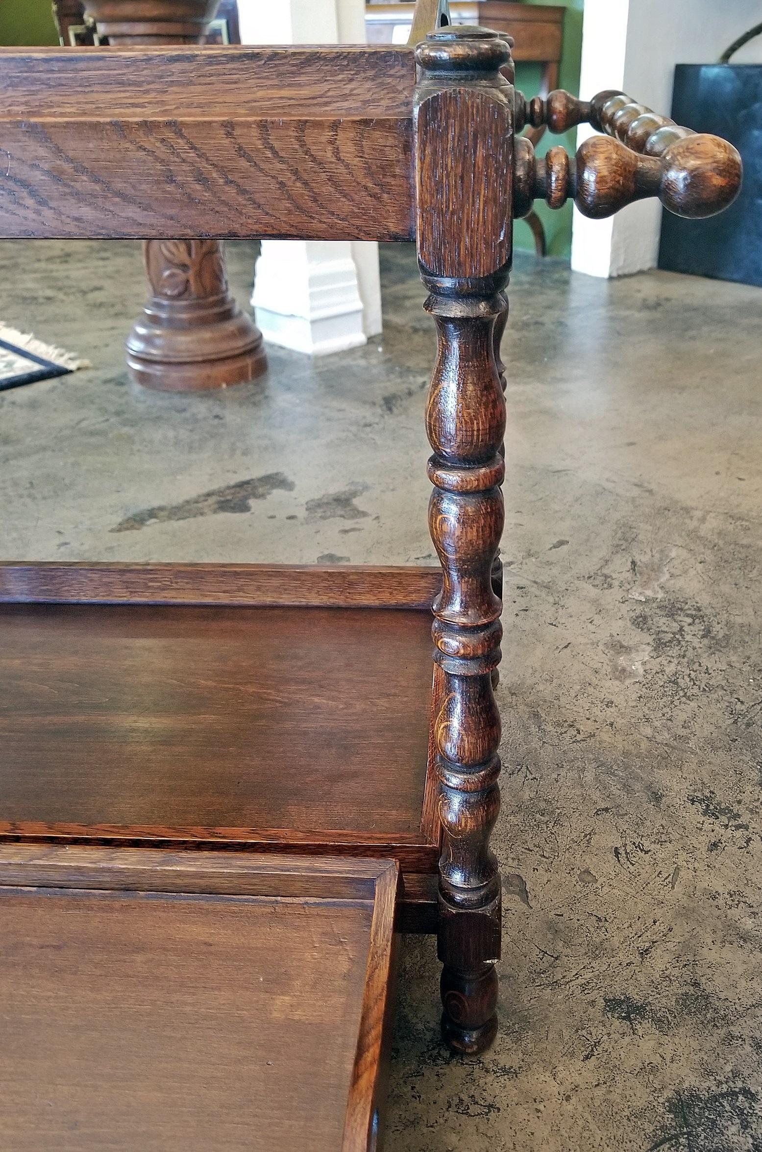Really cute 19th century, oak, provincial butler’s tray stand with 3 butler’s trays.

2 on top and 1 on bottom and all different sizes.

Stand has hand-turned support columns and handles.

The trays simply sit on the stand with the 2 larger