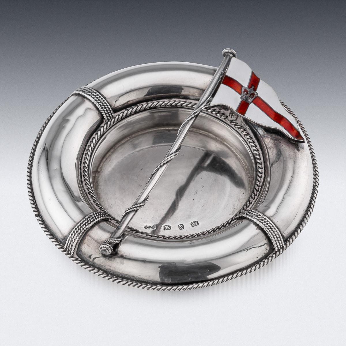 Antique late 19th Century Victorian solid silver & enamel life belt and flag shaped ashtray, Of round shape, mounted with twisted rope shaped boarders, applied with The Royal Yacht Squadron flag.

Established on June 1, 1815, at the Thatched House