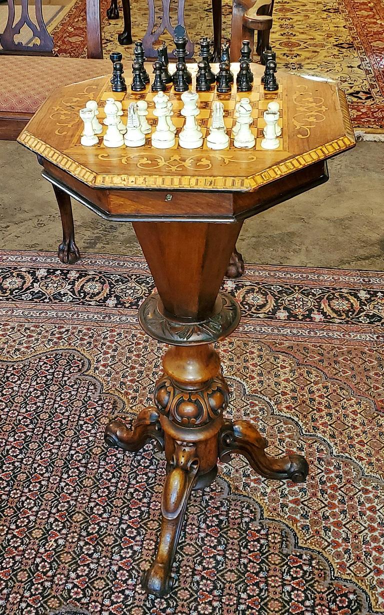 This is a gorgeous mid-19th century Victorian British cylindrical or trumpet sewing table/box on carved stand with beautiful parquetry inlaid lid/top with chessboard or checkers board design.

From circa 1860.

The Interior is in great shape with