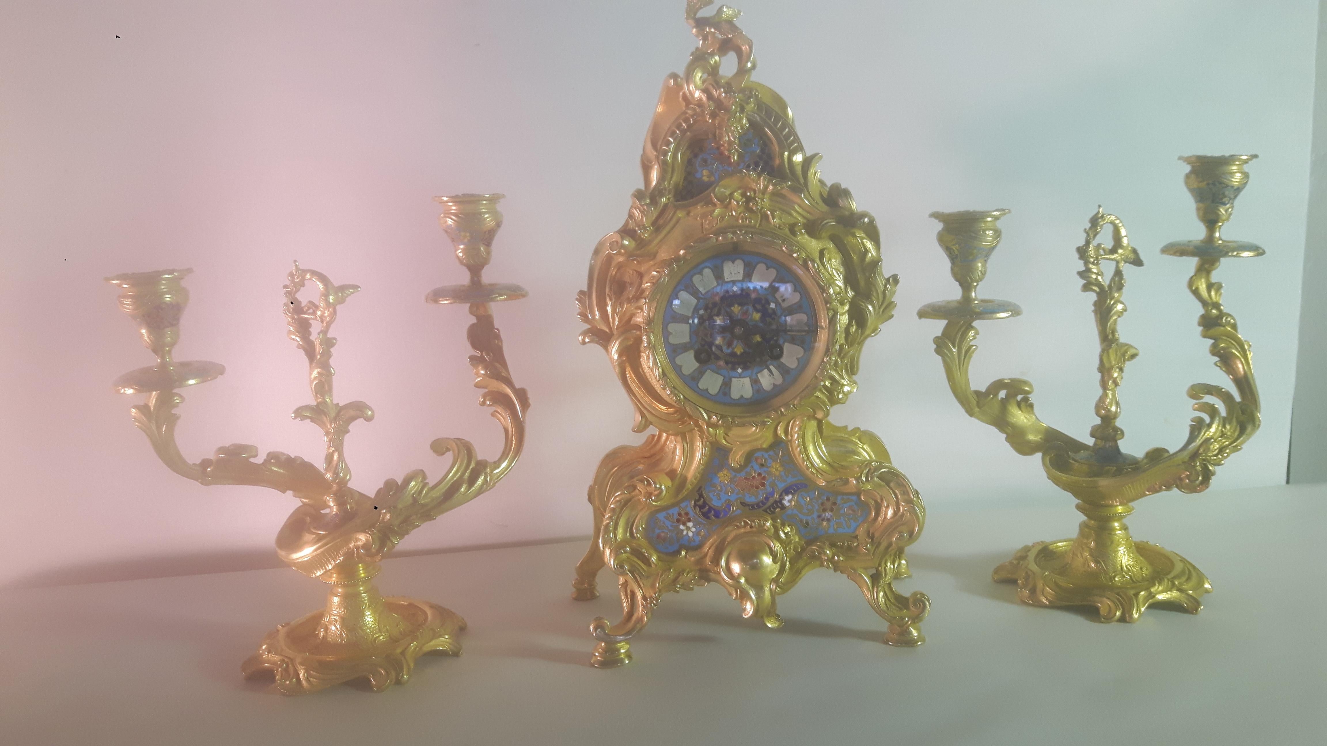French late 19th century clock set, consisting of a clock and a pair of matching candelabras.