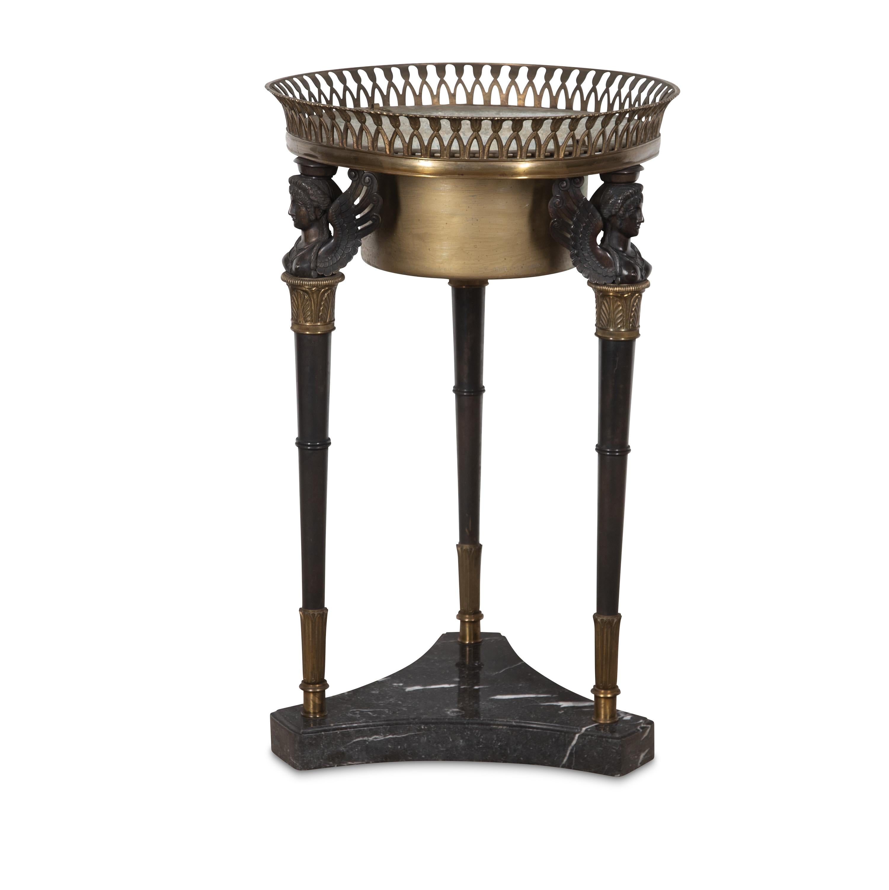 
Home / Stock / 19th Century Bronze Athenienne
PrevNext


﻿ A fantastic large C19th Athénienne, the pierced gilt bronze rim with removable liner above burnished bronze sphinxes and tapering monopodiums with enchased gilt bronze collars, supported on
