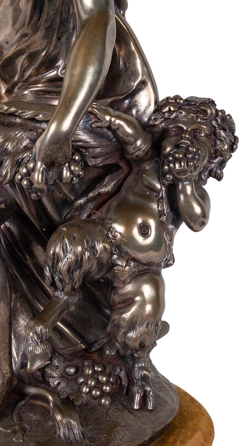 A very good quality 19th century patinated silvered bronze Bacchus influenced group.
Signed; Clodion.