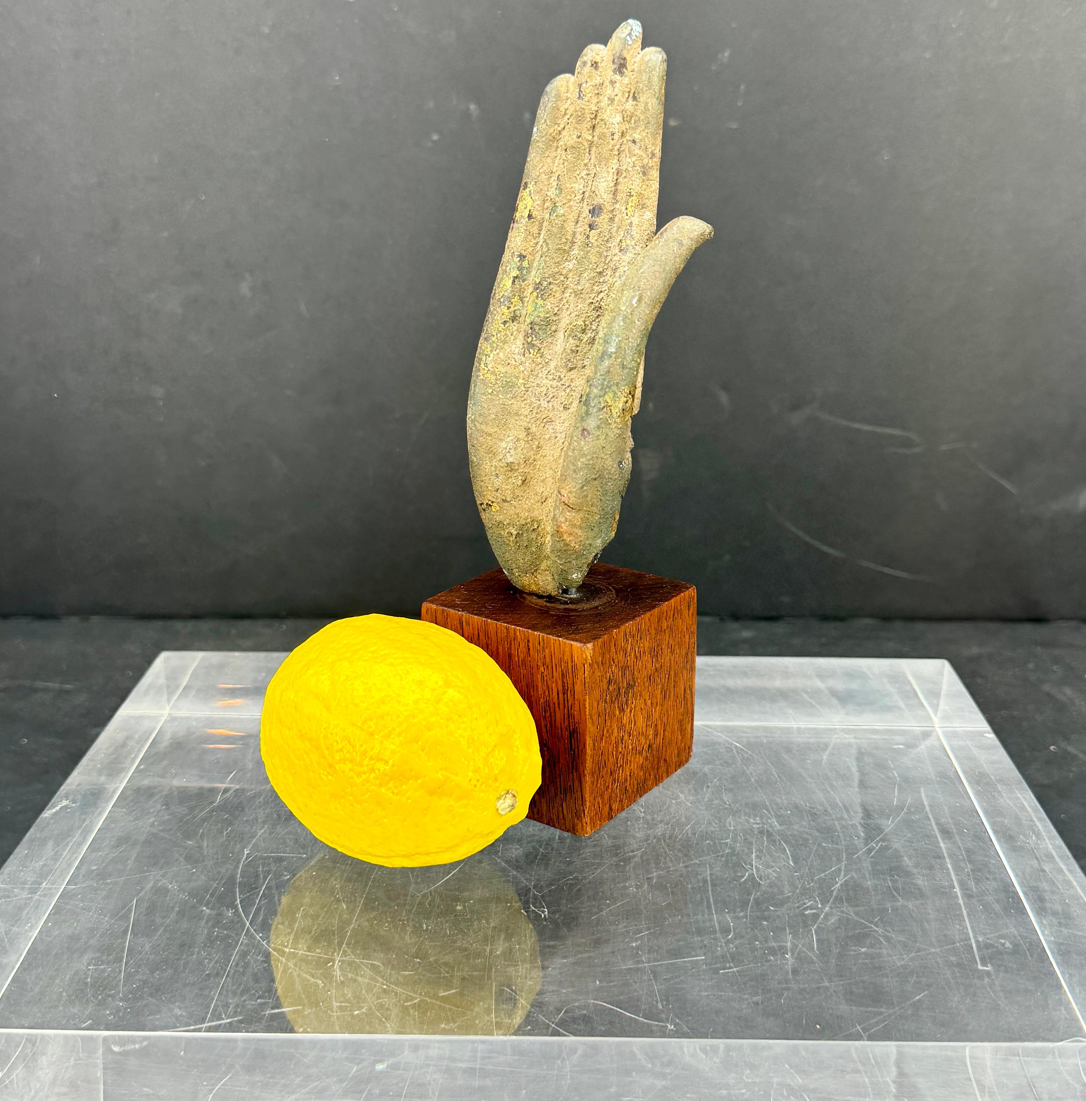 Buddha Hand Fragment on Walnut Stand from a 19th Century Bronze Buddha Statue