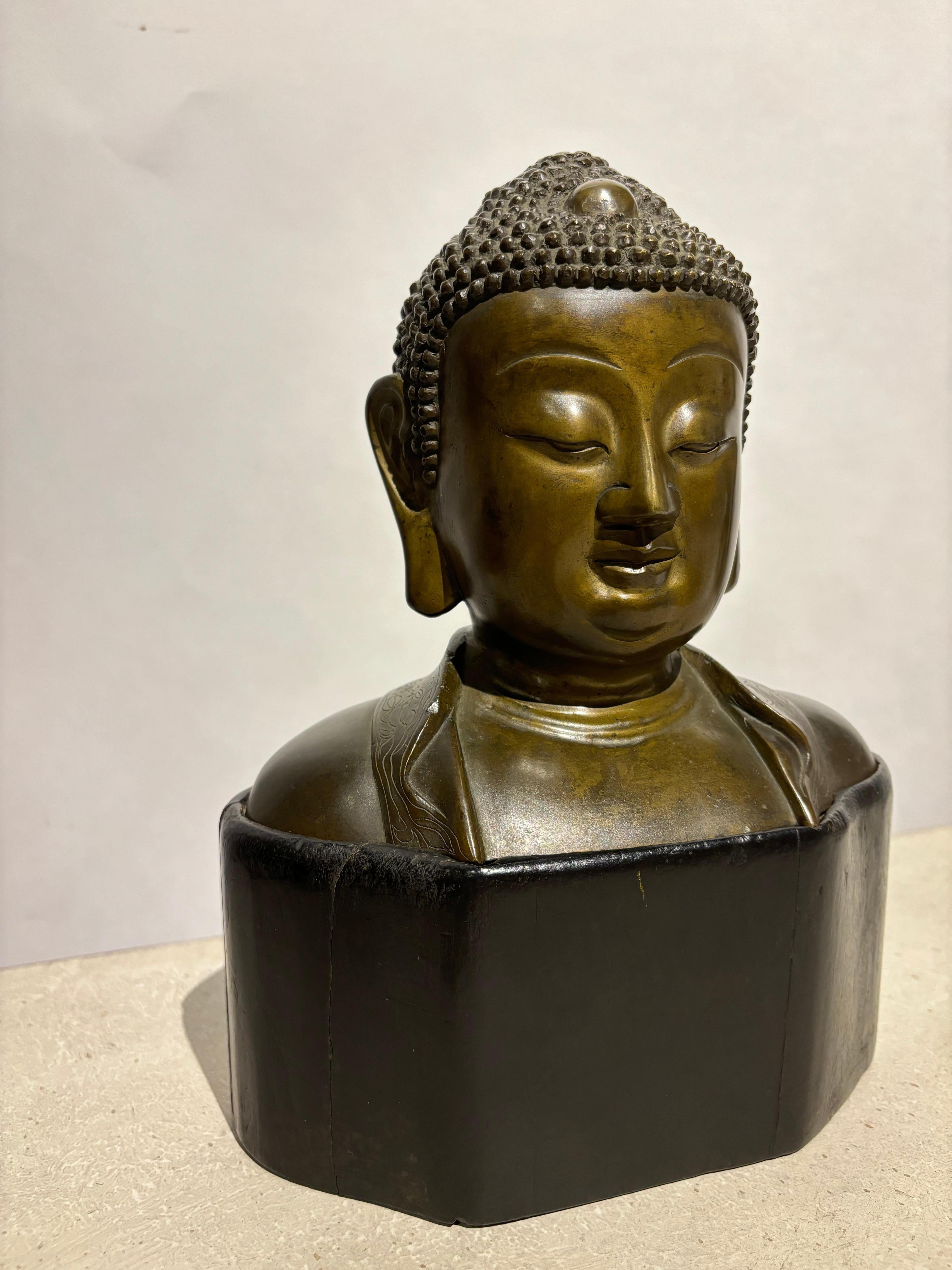 Chinese 19th Century Bronze Bust of Buddha on a Wooden Base For Sale