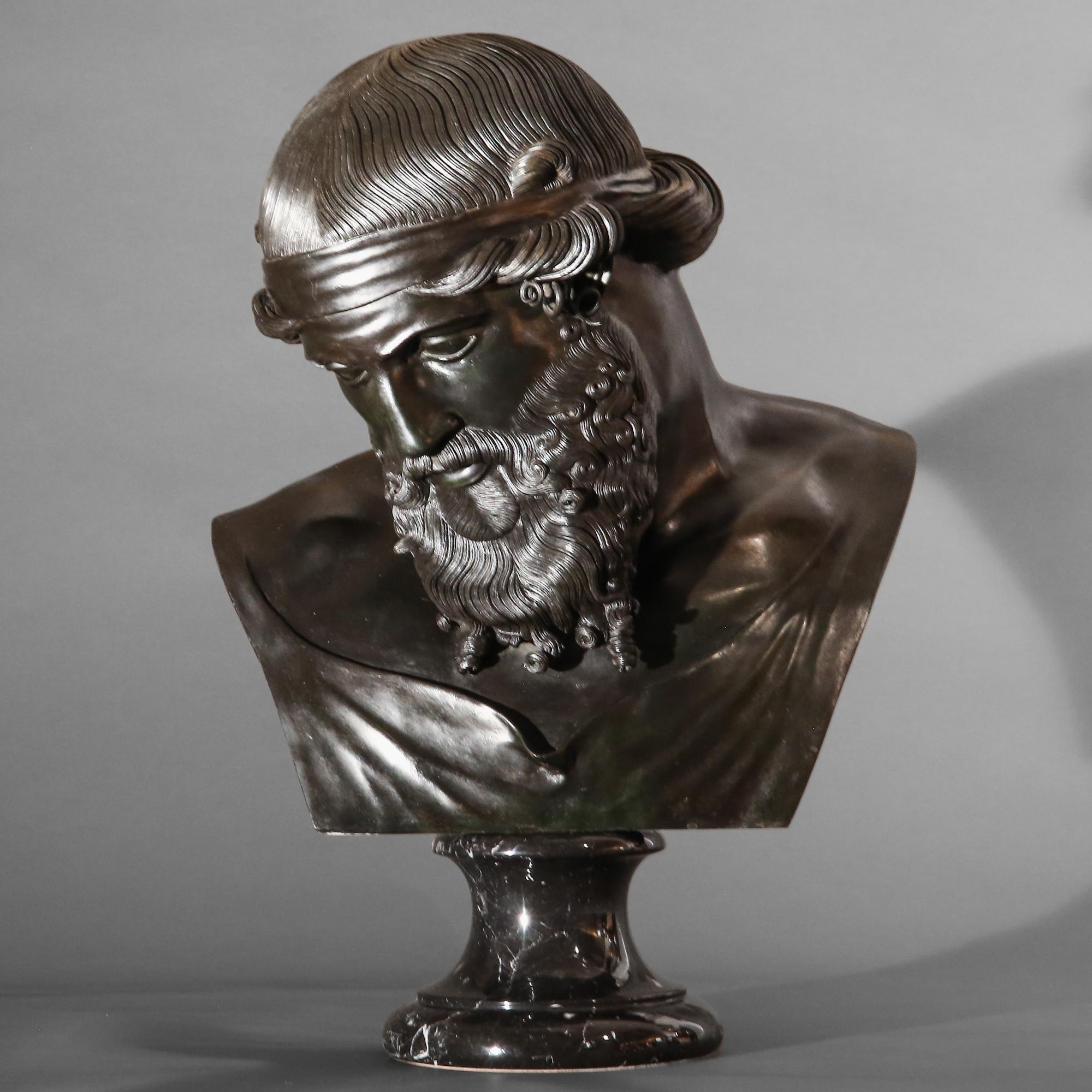 A superb 'Grand Tour' bronze bust, traditionally described as Dionysus (Dionysos), after the original excavated at the Villa of the Papyri in 1754, by the Sabatino and Sons foundry, Naples.

Mounted on a marble socle base. Italy, 1890–1900.

Superb