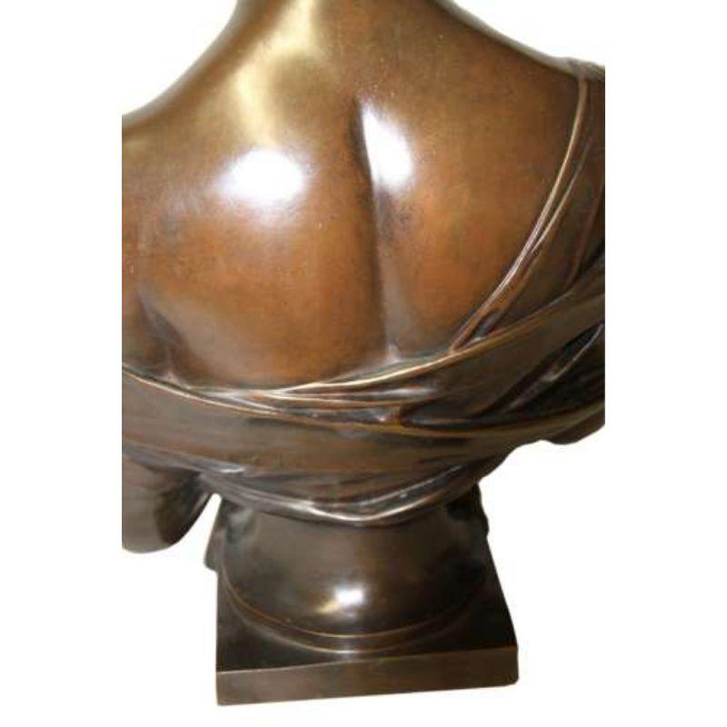 A fine Large 19th Century Bronze bust of Madame Juliette Recamier

Coyly looking down, Madame Recamier holds a veil across her chest. The sheath both demurely conceals and reveals her breasts. Sculptor Joseph Chinard cleverly compensated for the