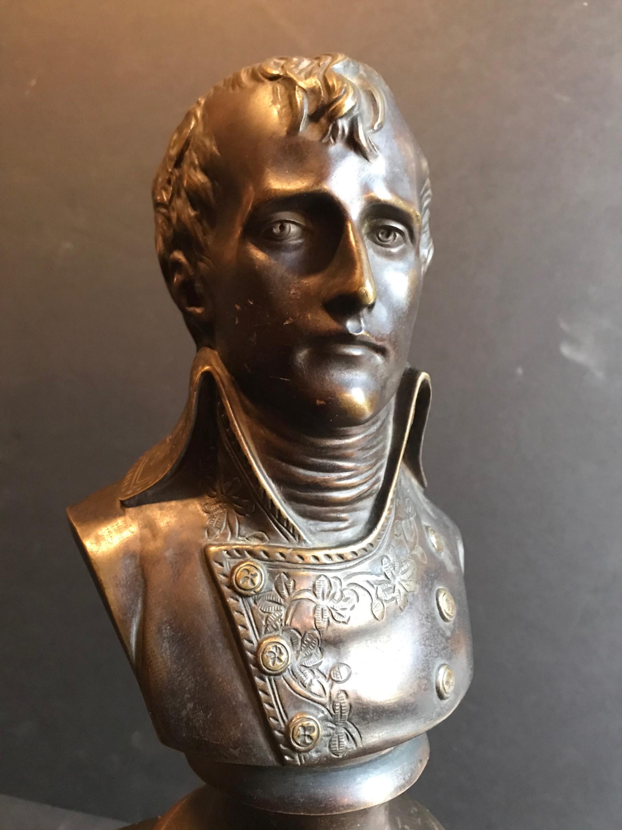 This is a fine bronze bust of the Emperor Napoleon I (1769-1821) of France. It depicts a young Napoleon Bonaparte in uniform casted on an integral round base. Mounted on a marble plinth, it represent an impressive and patriotic piece of art. The