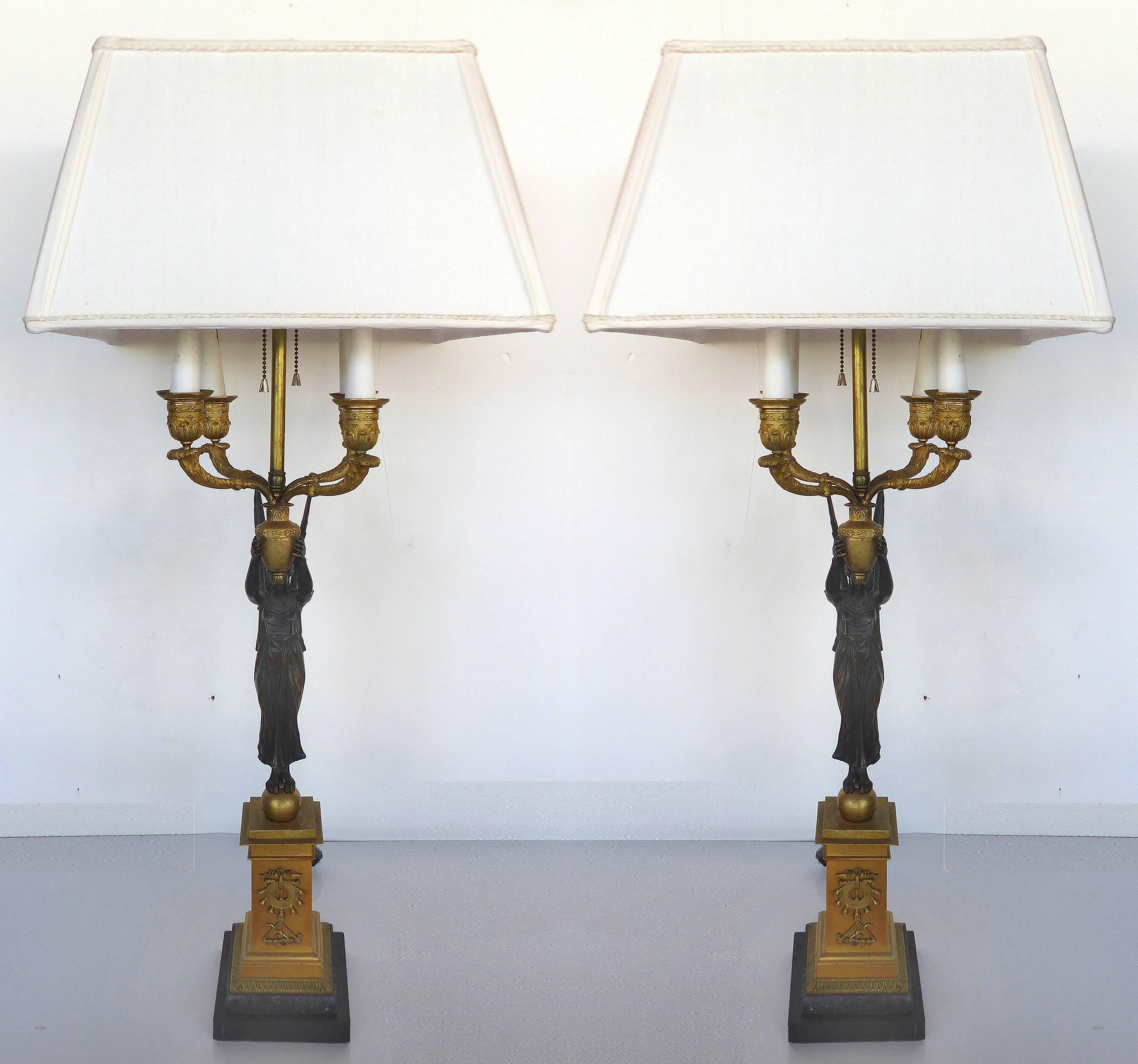 Fine French Empire 19th Century Bronze Candelabras Mounted as Lamps, Pair

A pair of fine French 19th century Empire bronze candelabras that have been electrified and converted to table lamps. Each has four removable carved wood faux-candles with