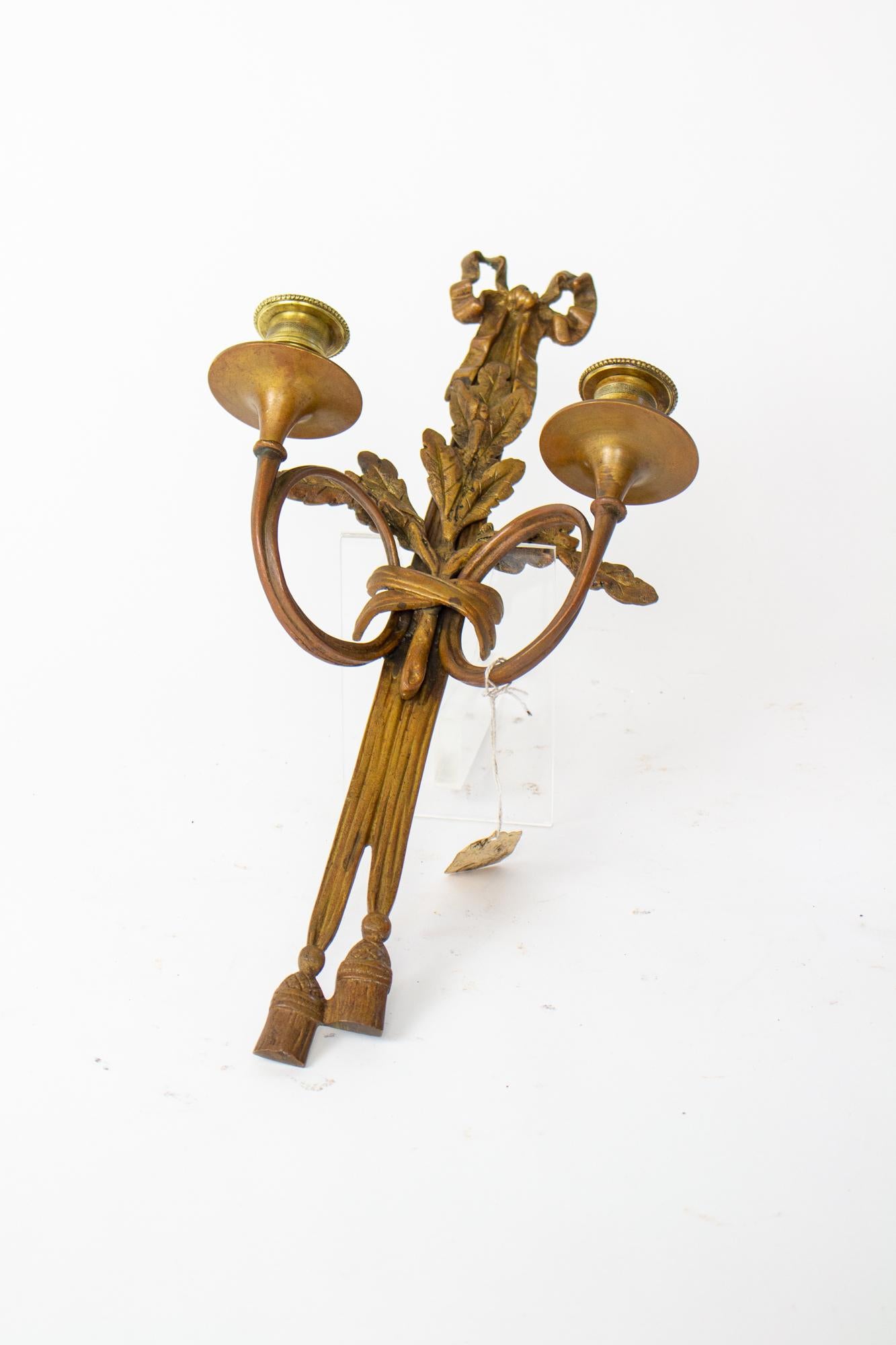 19th Century bronze candle sconce. beautiful casting of a ribbon and sheath of wheat. Two candle ups on slender arms. not electrified. 

Dimensions: 
Width: 8