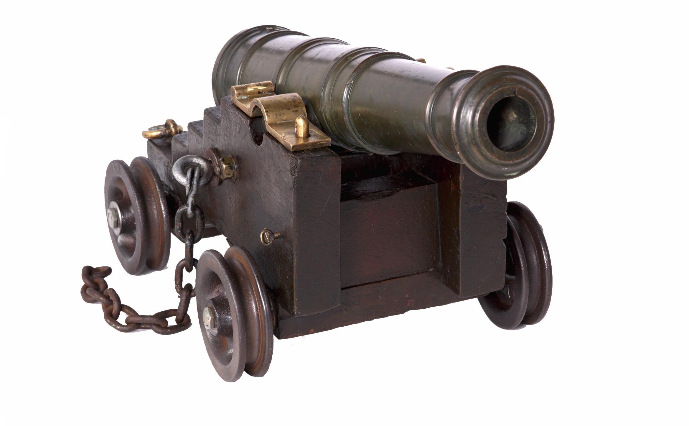 Love this beauty a real antique solid bronze cannon with carriage in superb working order. Though it could be used as one it is large for use as a signal cannon. Designed as a small working cannon to shoot ball or shot unusual to have the heavy iron
