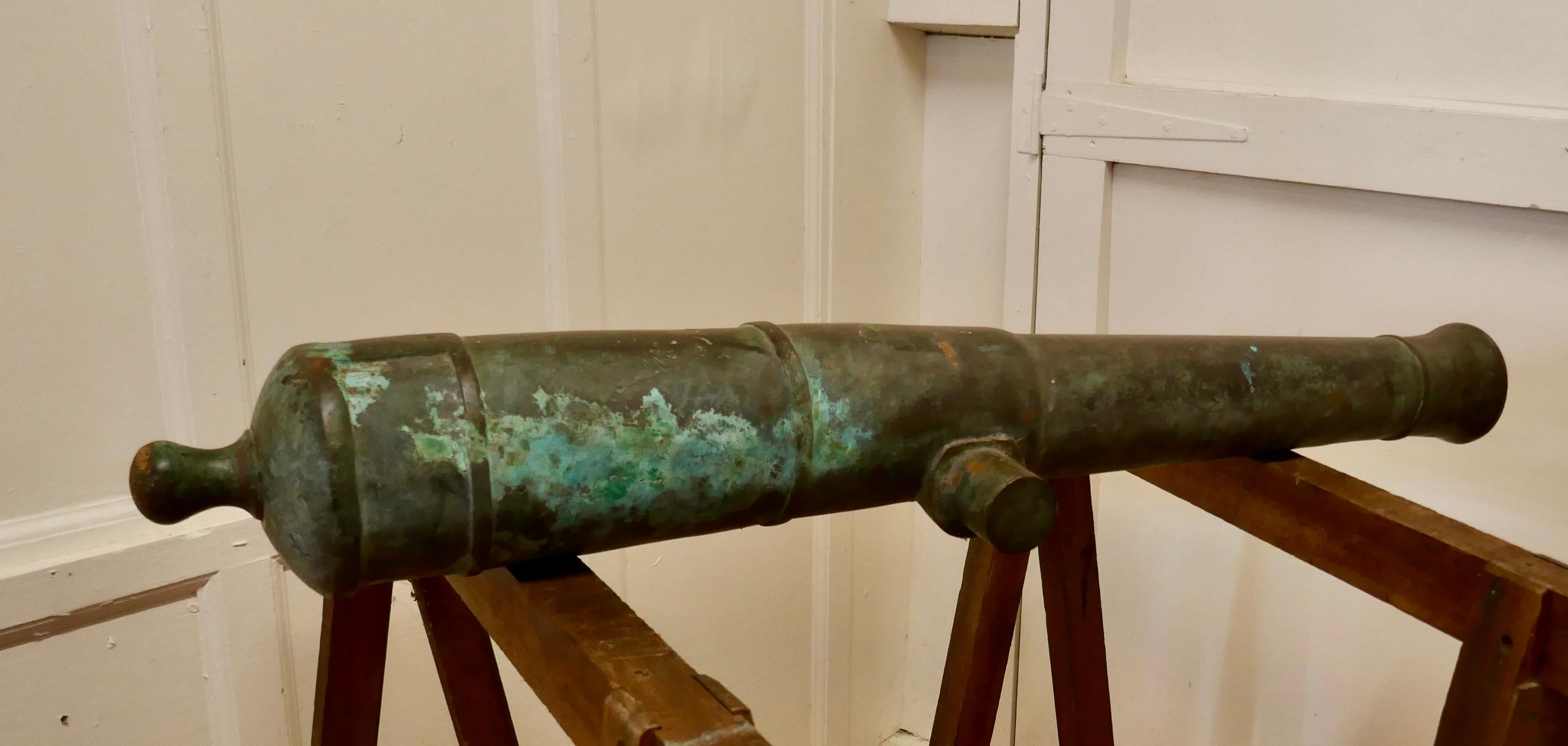 19th century bronze cannon

This wonderful piece is heavy and in sound condition with considerable verdigris patination, I think it may have been rescued from the sea bed, there are no identification markings visible 
The cannon is 40” long and