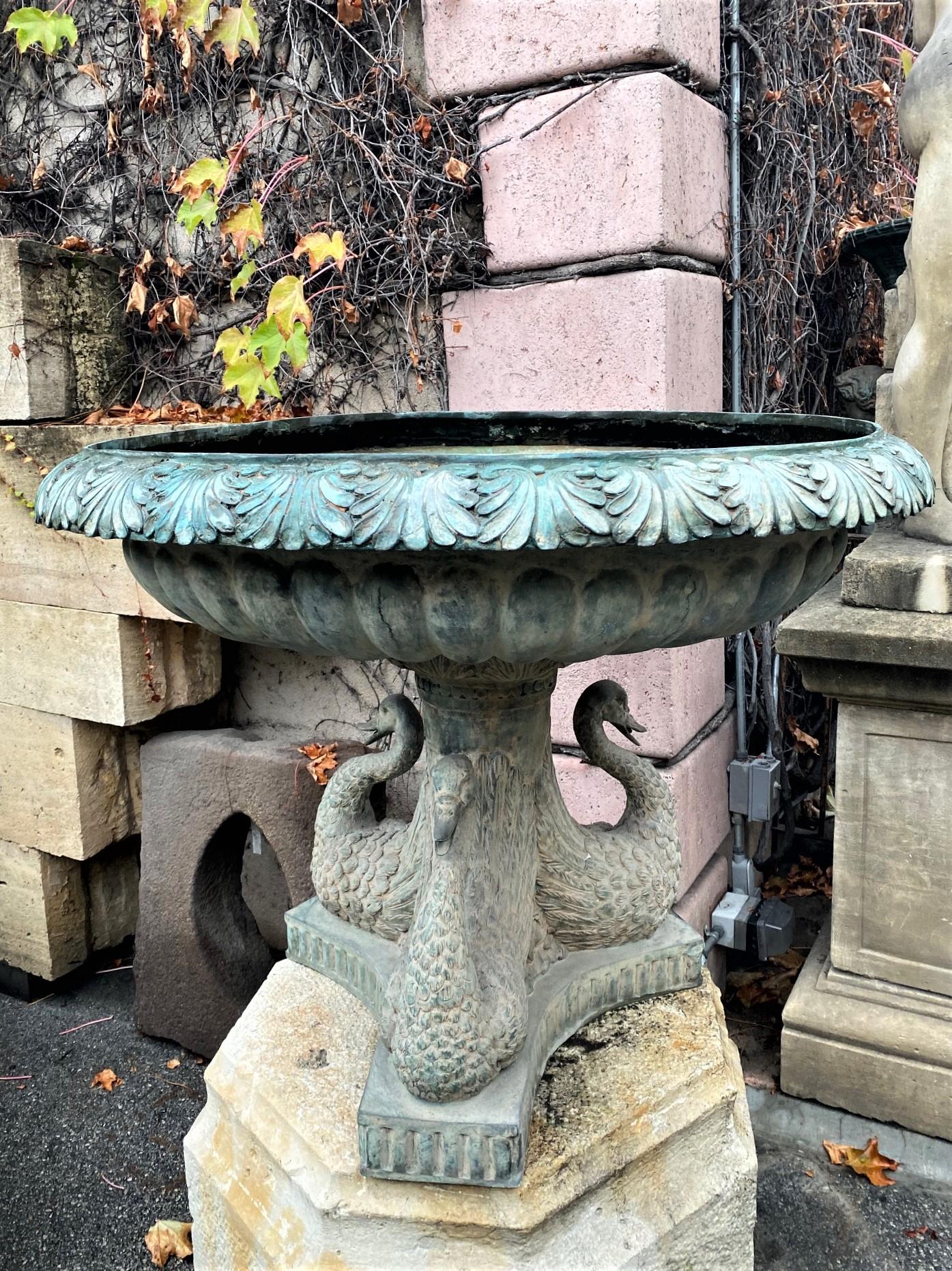 Late 19th-early 20th century very nice and detailed Hand work of late 19th century cast bronze garden water feature of 3 swans figures topped with a jardinière Urn vase shape basin. It could be used in the center of a pond or lake or basin or
