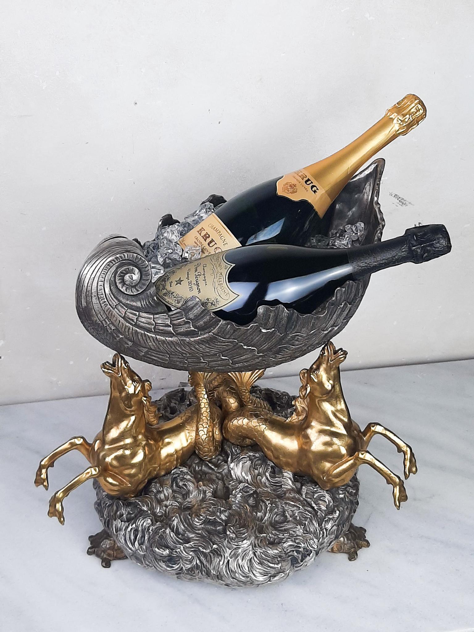 19th century bronze centre piece Venus shell champagne cooler. This imposing and heavy table piece (Surtout a table) is a made of silver plated and gilt bronze. The large Venus Shell (that easily holds 2 bottles) is supported by fine gilt bronze