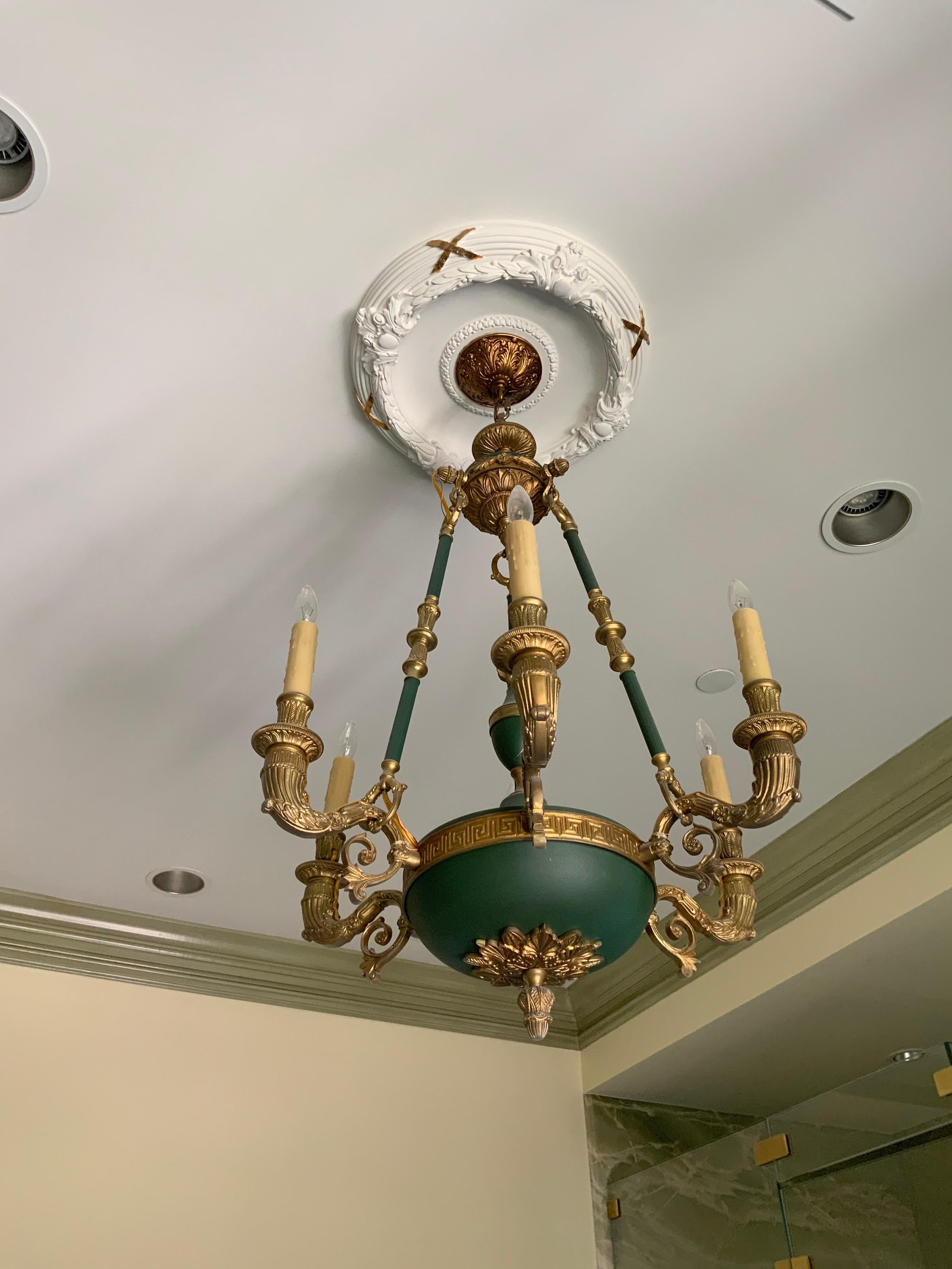 This bronze chandelier is Empire style and origins from France.

6 lights.

19th century period.

 