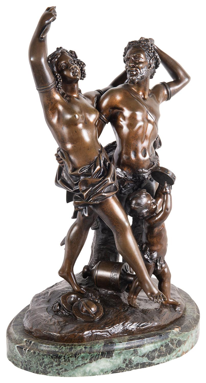 An amusing classical 19th century bronze study of Bacchus influenced lovers dancing with a child at their feet, mounted on a Green marble base.
Signed; Clodion.
