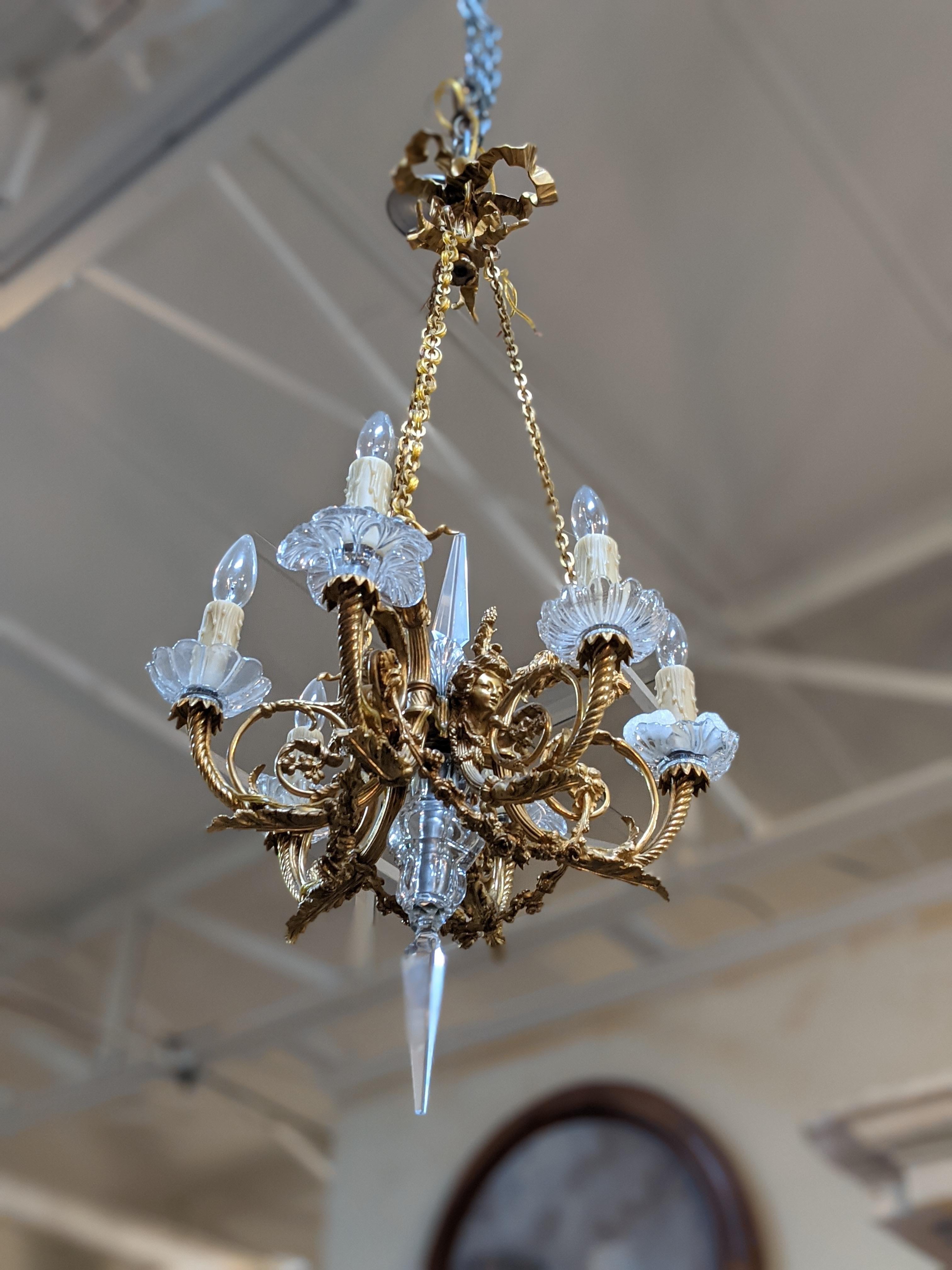 This bronze and crystal chandelier origins from France.

6 lights,

19th century period.