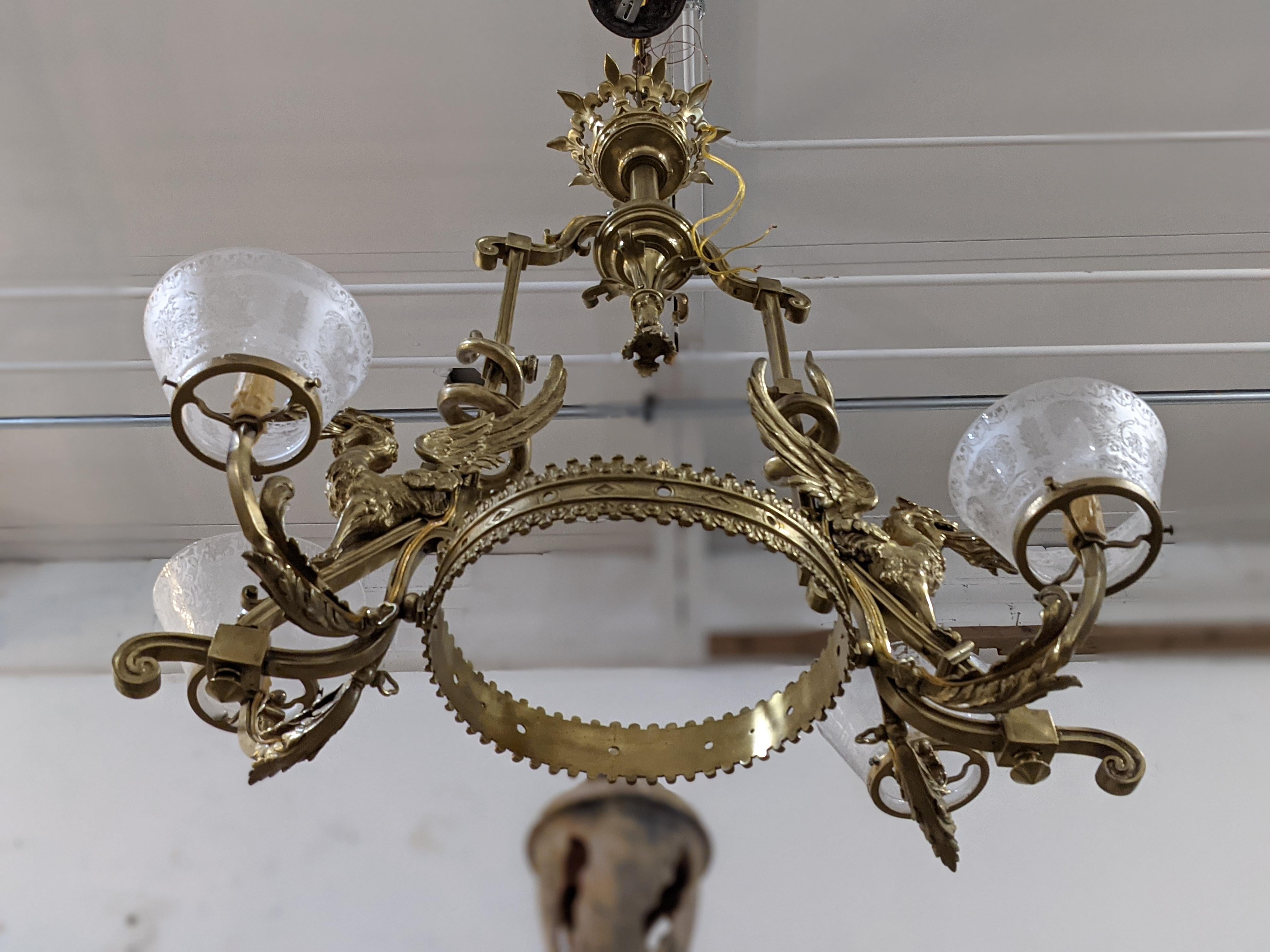 This bronze & crystal chandelier with 4 lights origins from France.

19th century period.

 