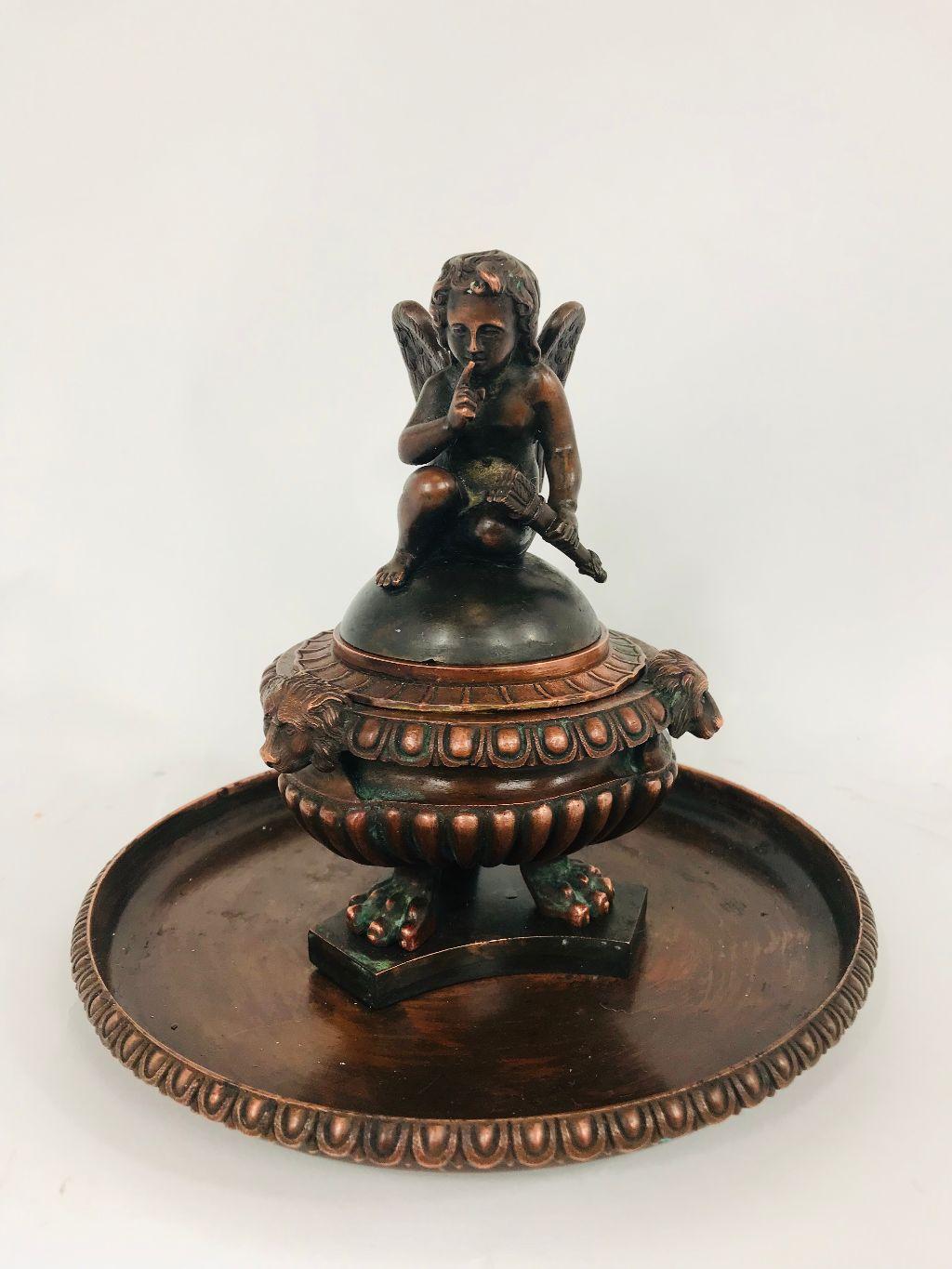 Superb late 19th century handmade heavy figural bronze humidor adorned with a finely done mischievous cupid. Particularly well crafted in heavy natural bronze, not patinated. Can not claim a country of origin however bronze work of this quality was