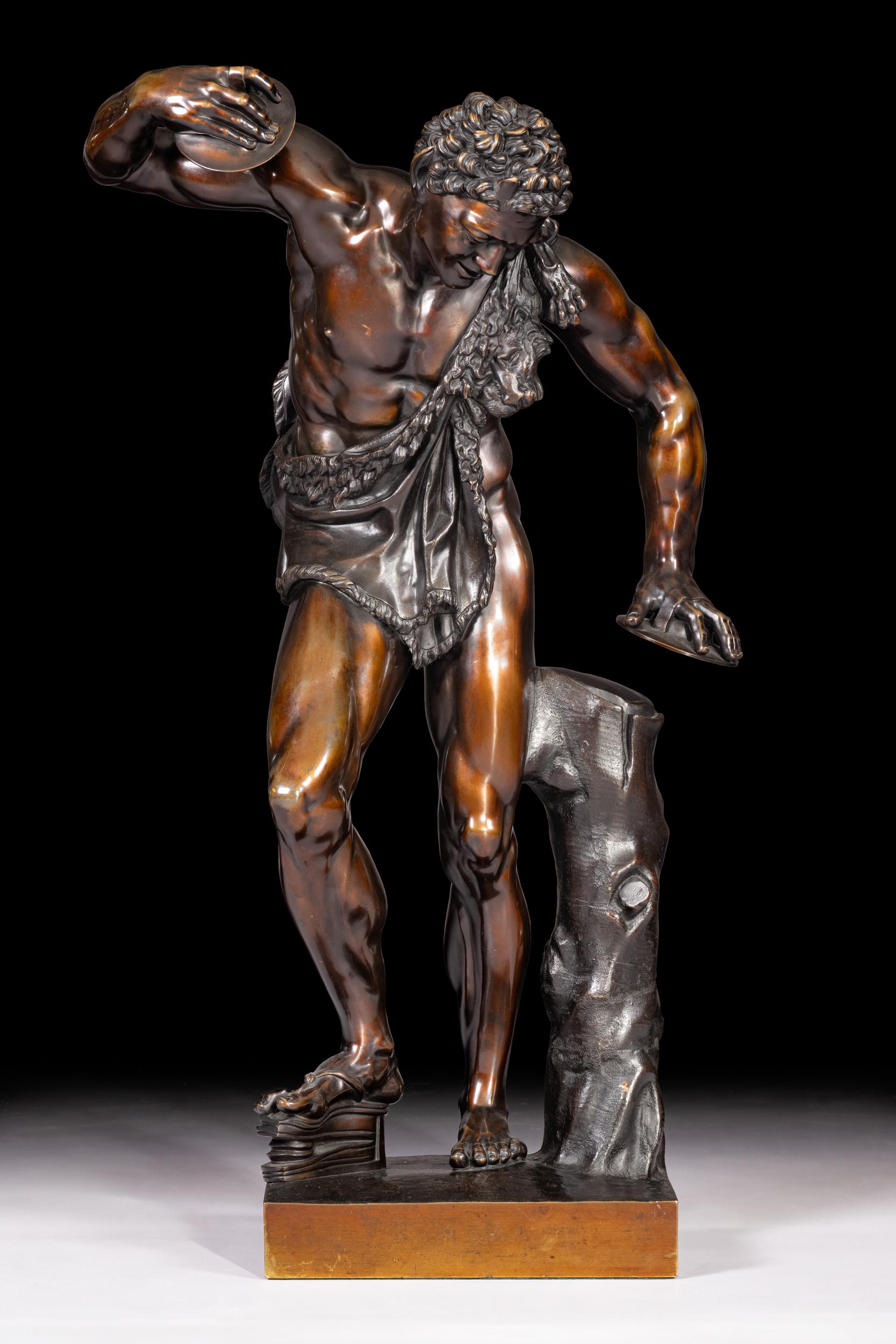 A superb and most impressive 19th century bronze figure of The Dancing Faun (a symbol of fertility) with Cymbals. The handsome faun displays a foot instrument while he stands aside a tree trunk. Raised on a rectangular base, signed Musee De Naples.