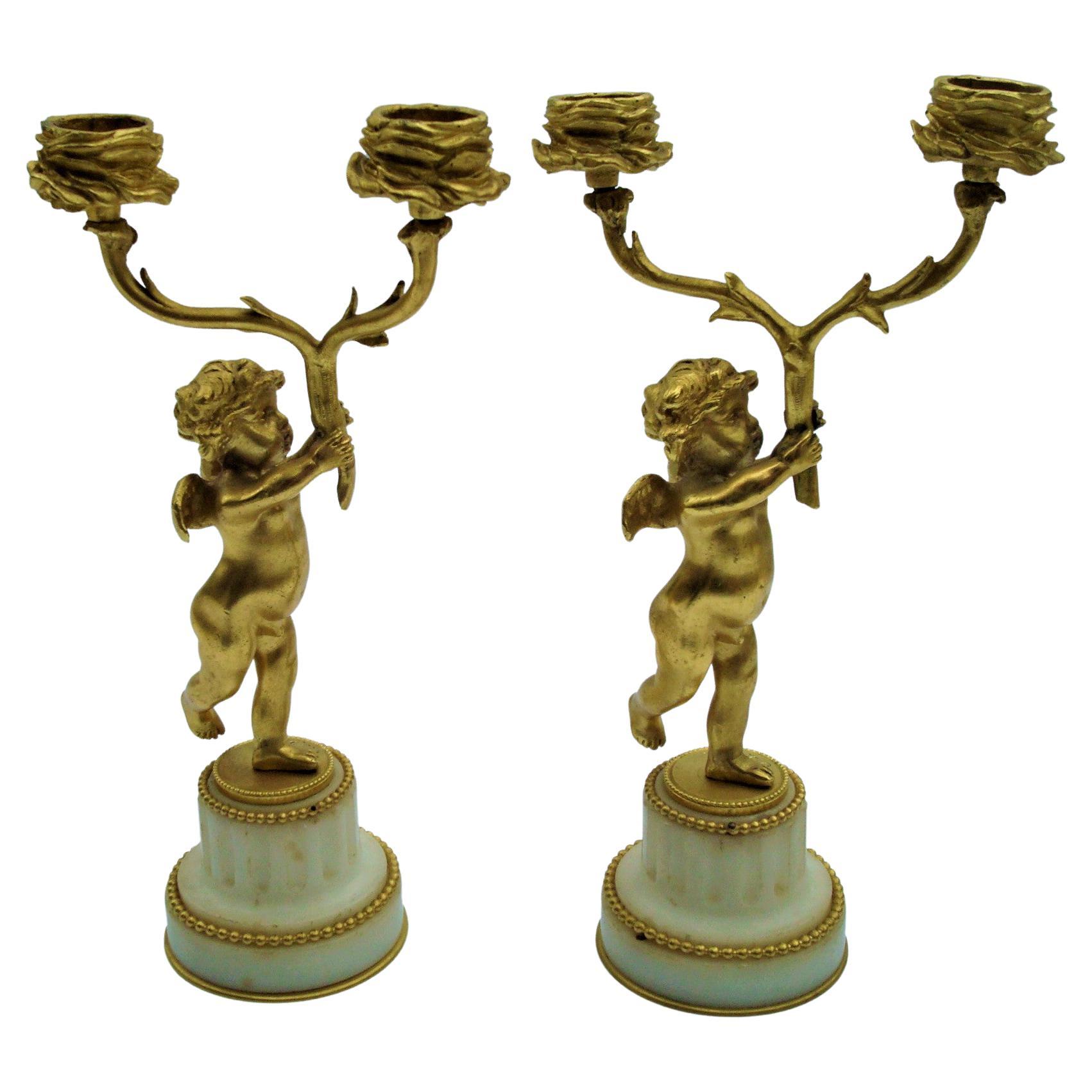 Candelabro figurato a due bracci con cherubino in bronzo placcato oro del XIX secolo, F. Link