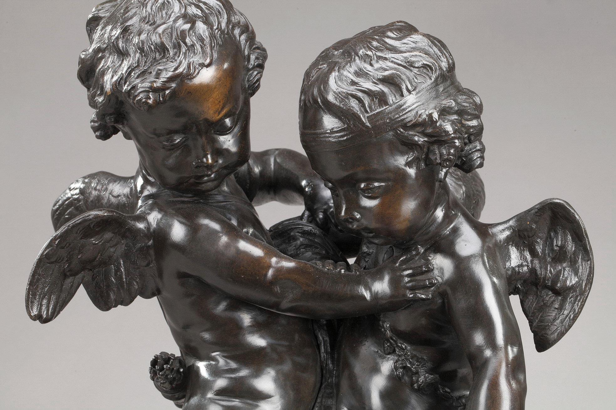 Bronze group with brown patina featuring Cupids fighting over a heart after Etienne-Maurice Falconet (1716-1791). This work had a great success in the second half of the 19th century, and was reproduced in bronze, marble or alabaster. The bronze is