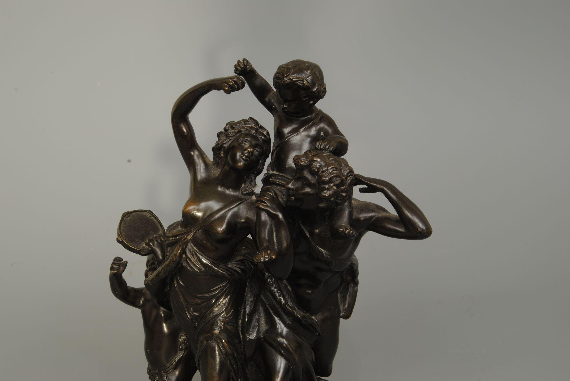 A charming Italian bronze of Baccus with dancing maiden and putti, good patination Circa 1840.