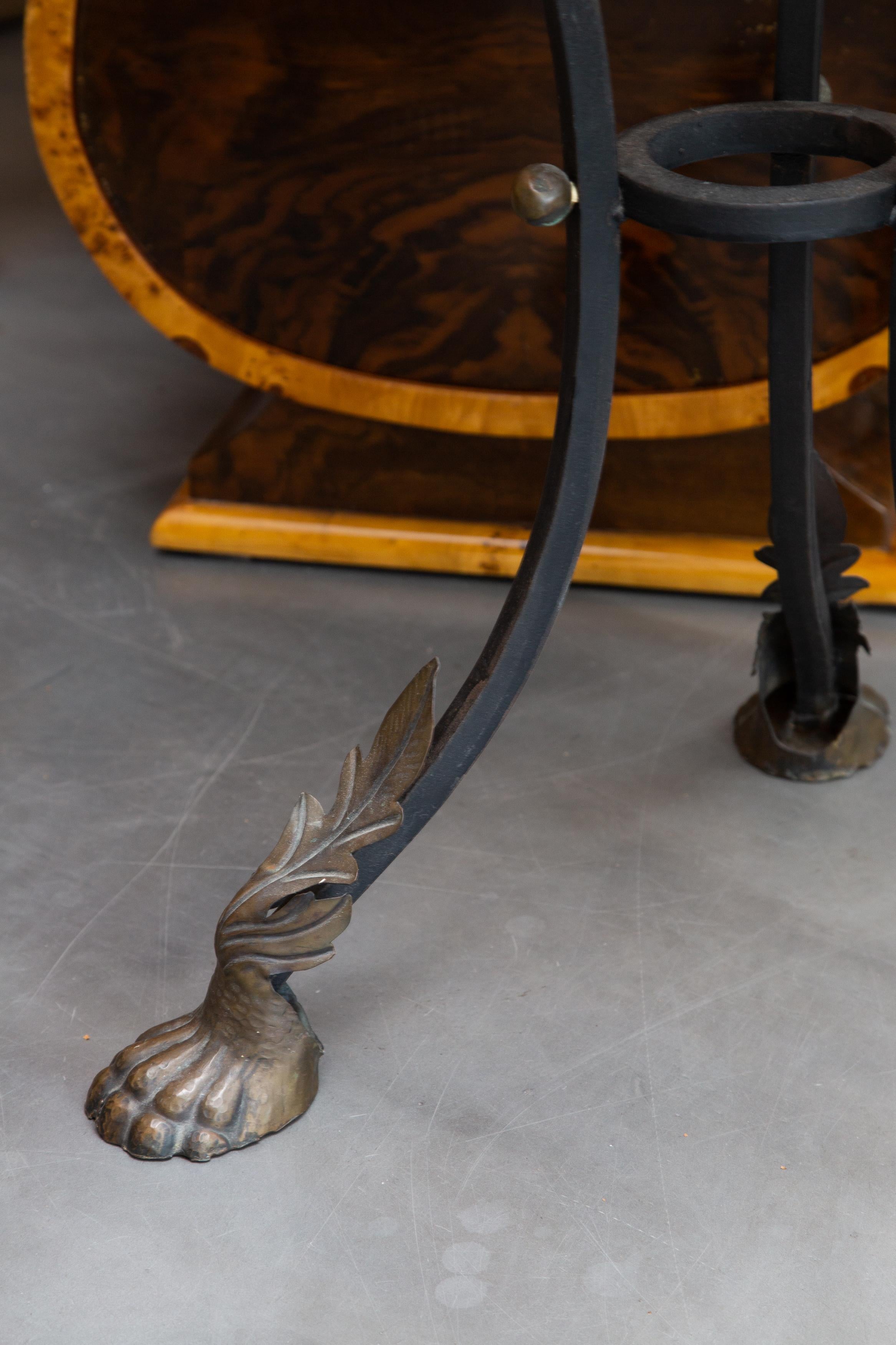 This is a stately bronze jardiniere with a large scalloped bowl resting on curved legs terminating in paw feet, 19th century.