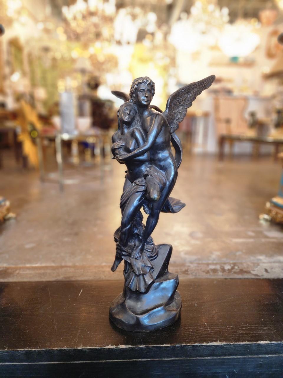 Intricate lovers in bronze statue. From the late 18th century. This piece stands at 23 in high 7 inches wide. Perfect addition for your study or reading room.
