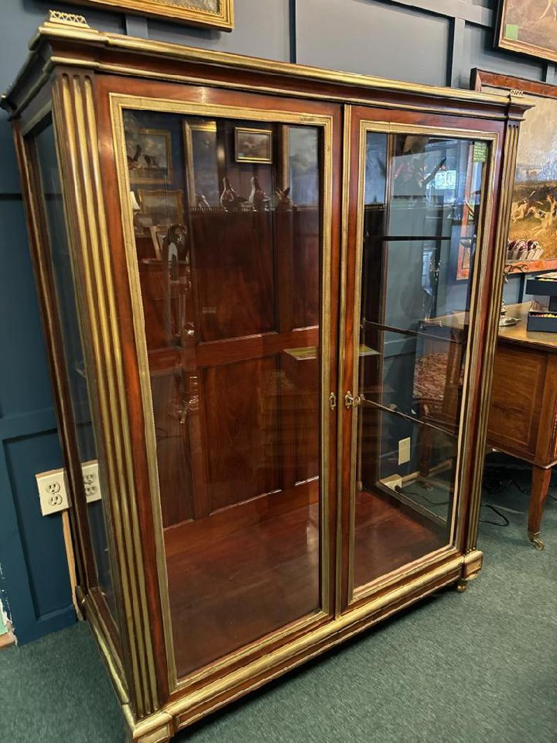 19th Century Bronze Mounted Mahogany Vitrine with Glass Shelves. Quality mounts throughout the case having four glass shelves, supported by nickel supports. Measures: 58