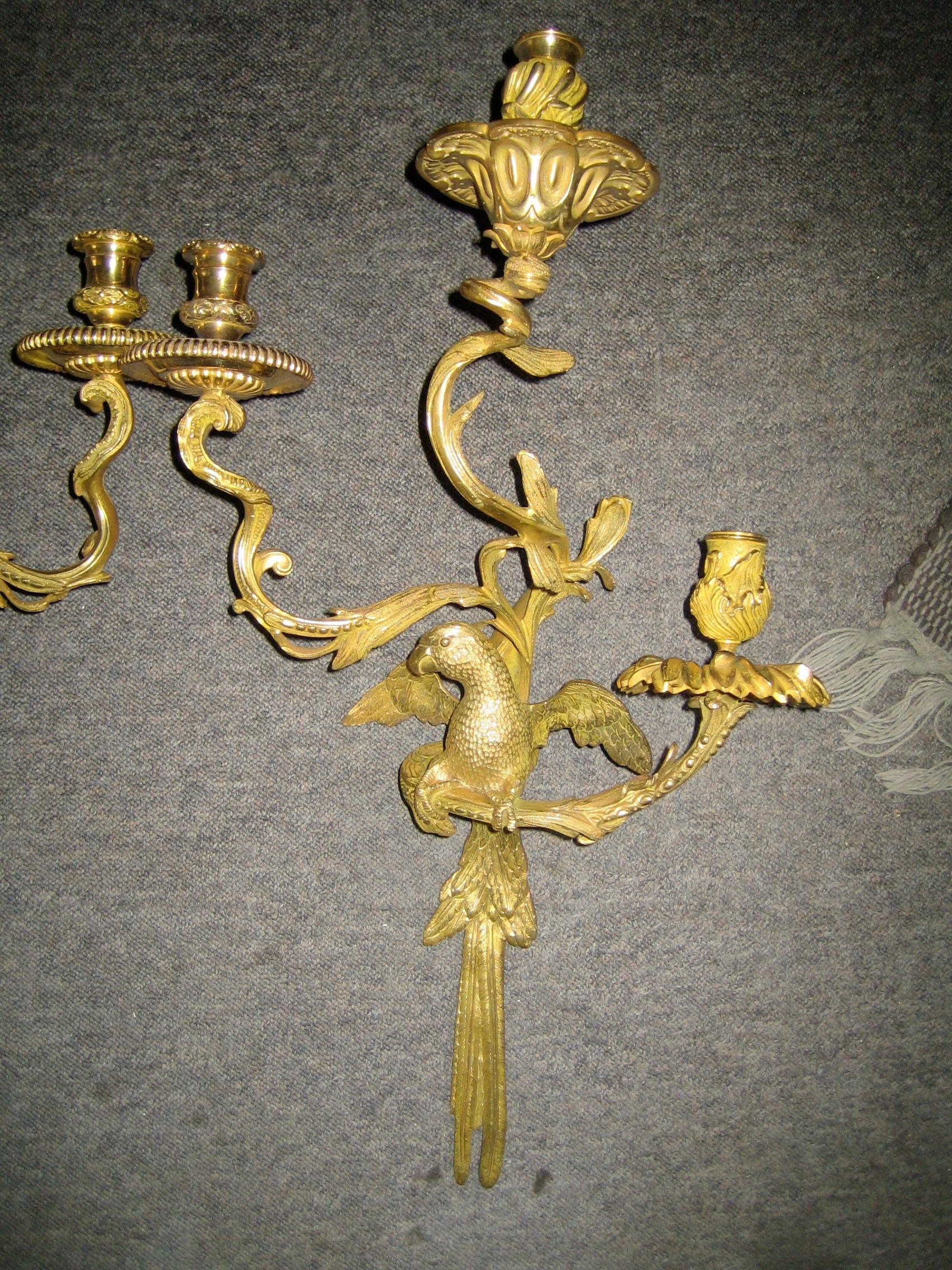 These are a pair of mid-19th century sconces (appliques) candelabras which were electrified. They are the Duc d'Enghien style sconces, as they were created by/for the Duke for his palace at Chantilly, where the originals can be seen as the last Duke
