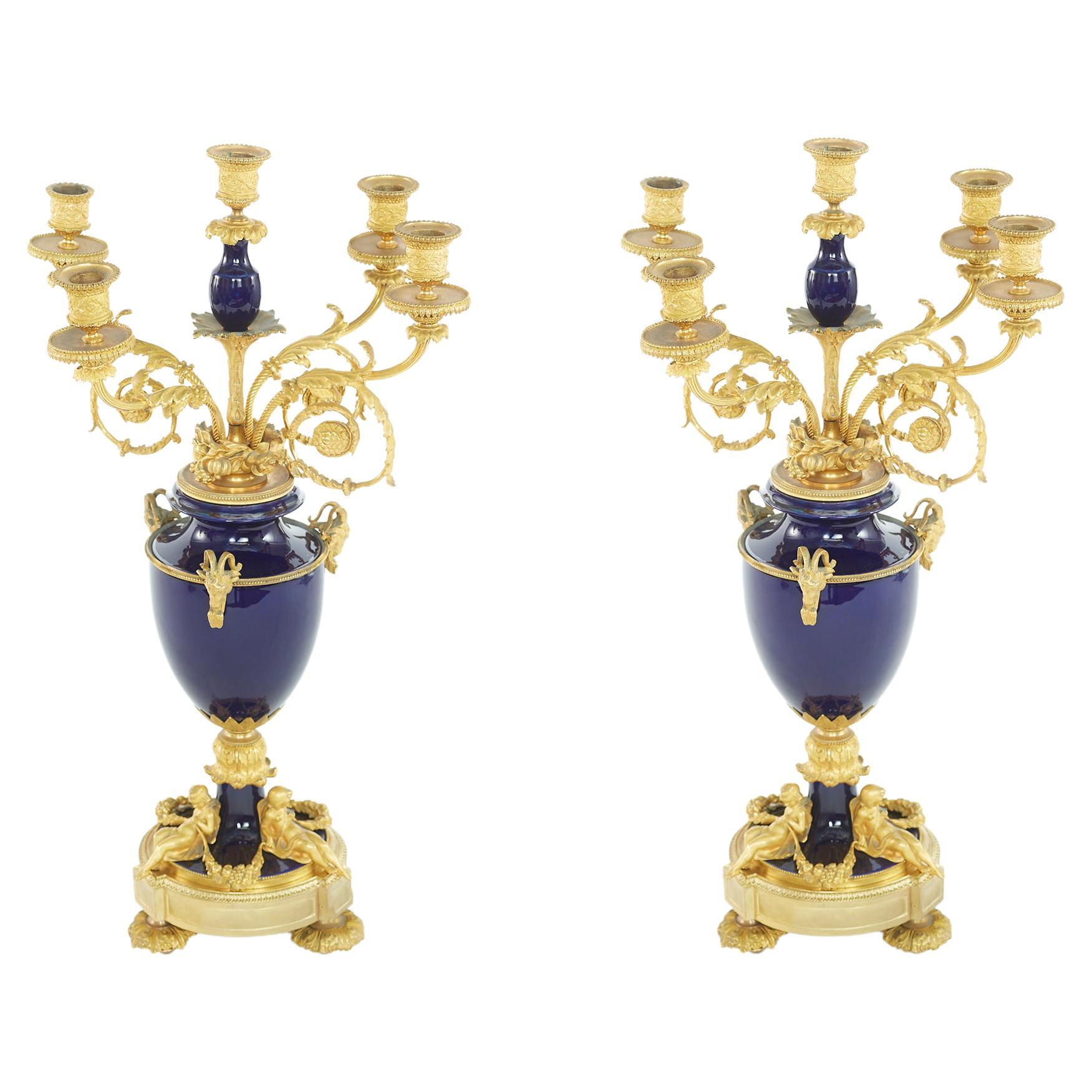 Paire de candélabres en bronze, bronze doré et porcelaine du 19ème siècle