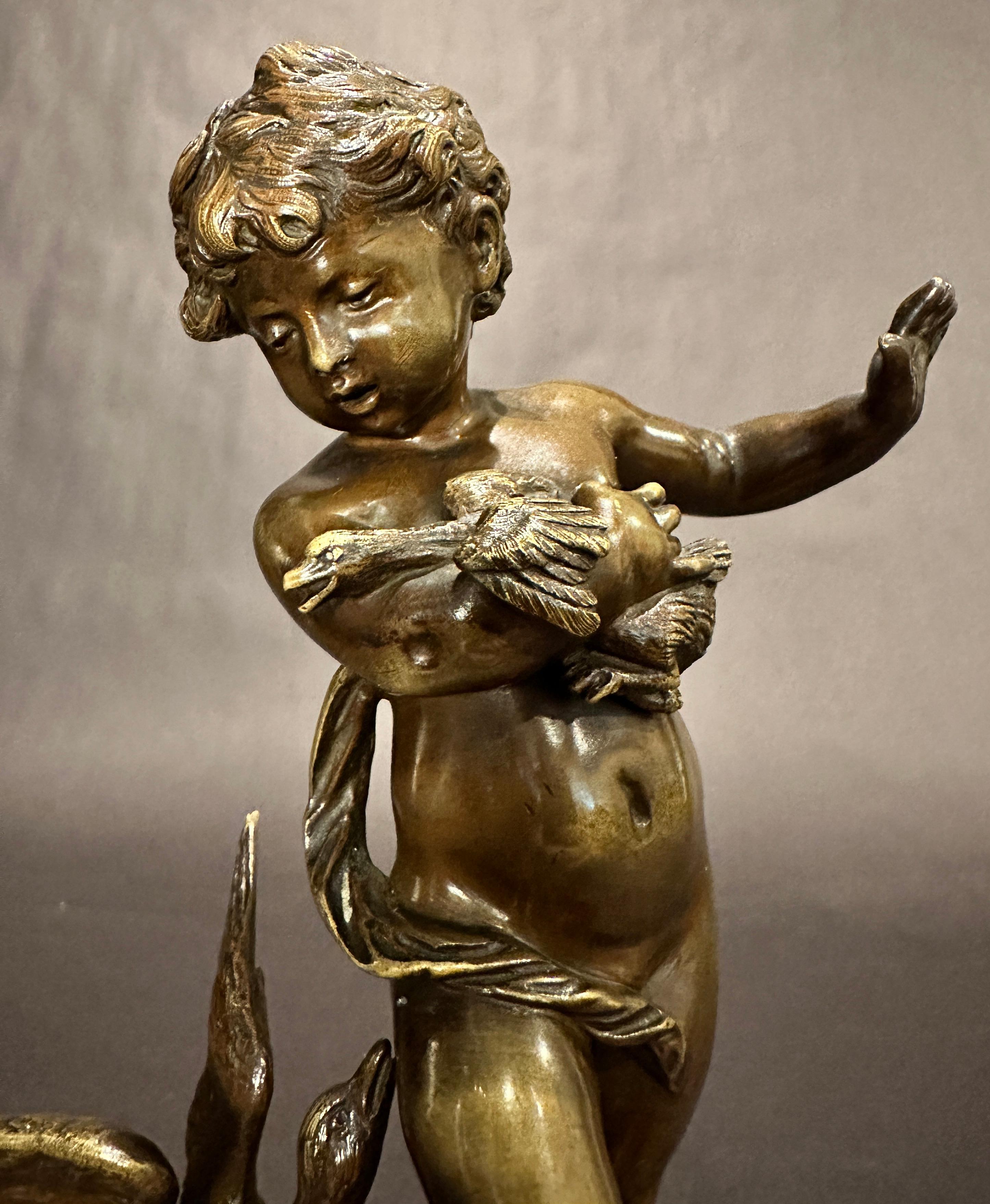 Auguste Moreau (1834 - 1917) Fine quality bronze sculpture of a young boy being confronted by a mother goose as he holds her baby. rich light brown patina. Signed and mounted on a rouge marble base.
 Auguste Moreau was born in Paris in 1834, the