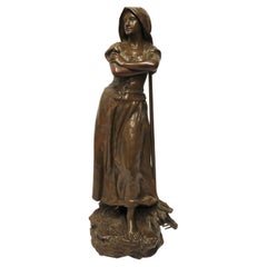 Sculpture en bronze du 19e siècle représentant une jeune femme se réunissant