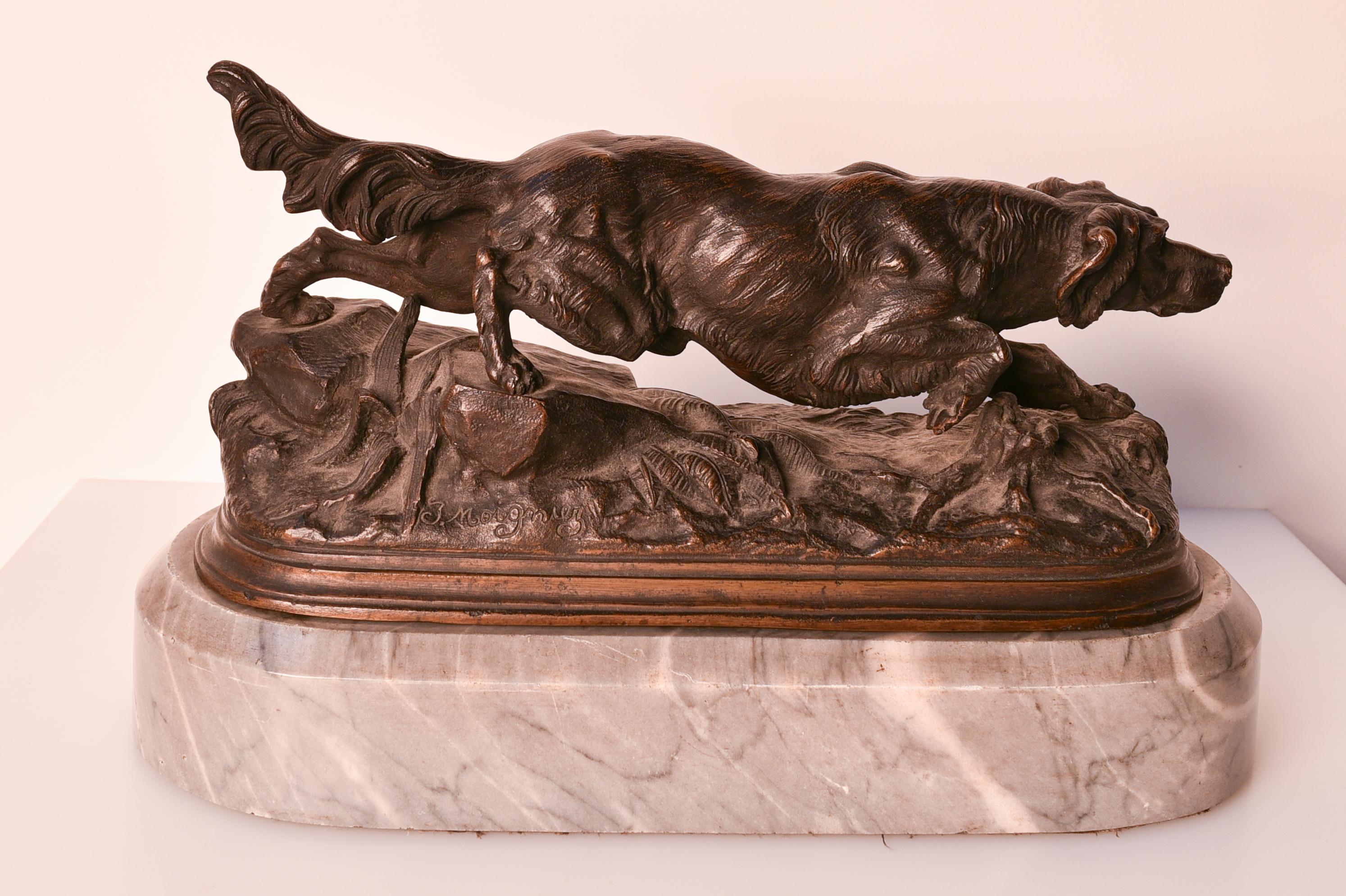 Jules Moigniez (1835 – 1894) was a French animalier sculptor who was best known for his bronzes depicting birds, horses and dogs. This sculpture is an Irish setter dog, which was put on a grey, marble socle. 