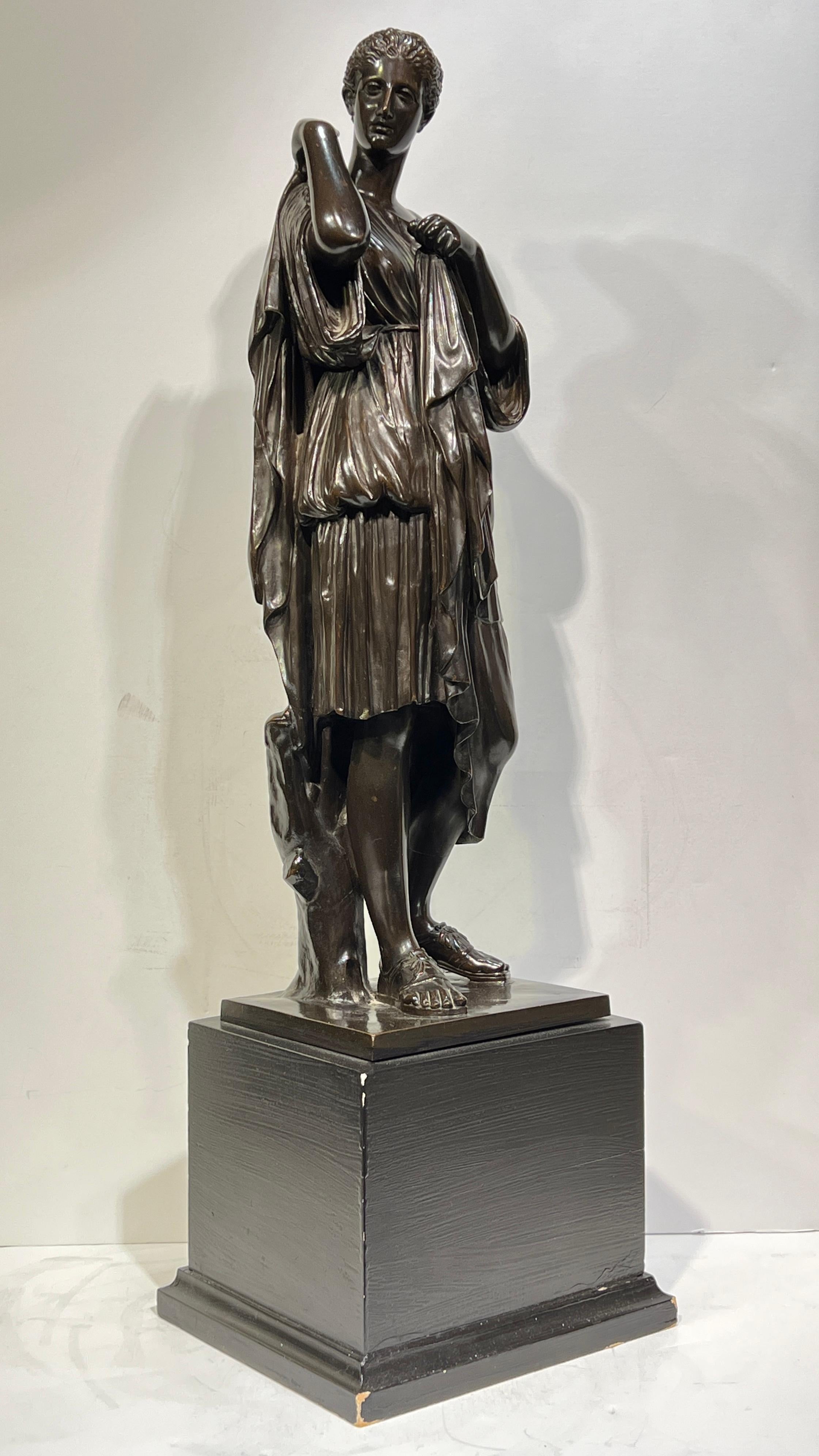 19th Century patinated bronze sculpture of Diana of Gabbi measuring 21.5 inches tall and 28 inches in total as shown mounted on its ebonized wooden pedestal.  With the stamped mark of Achille Collas who collaborated with Ferdinand Barbedienne in