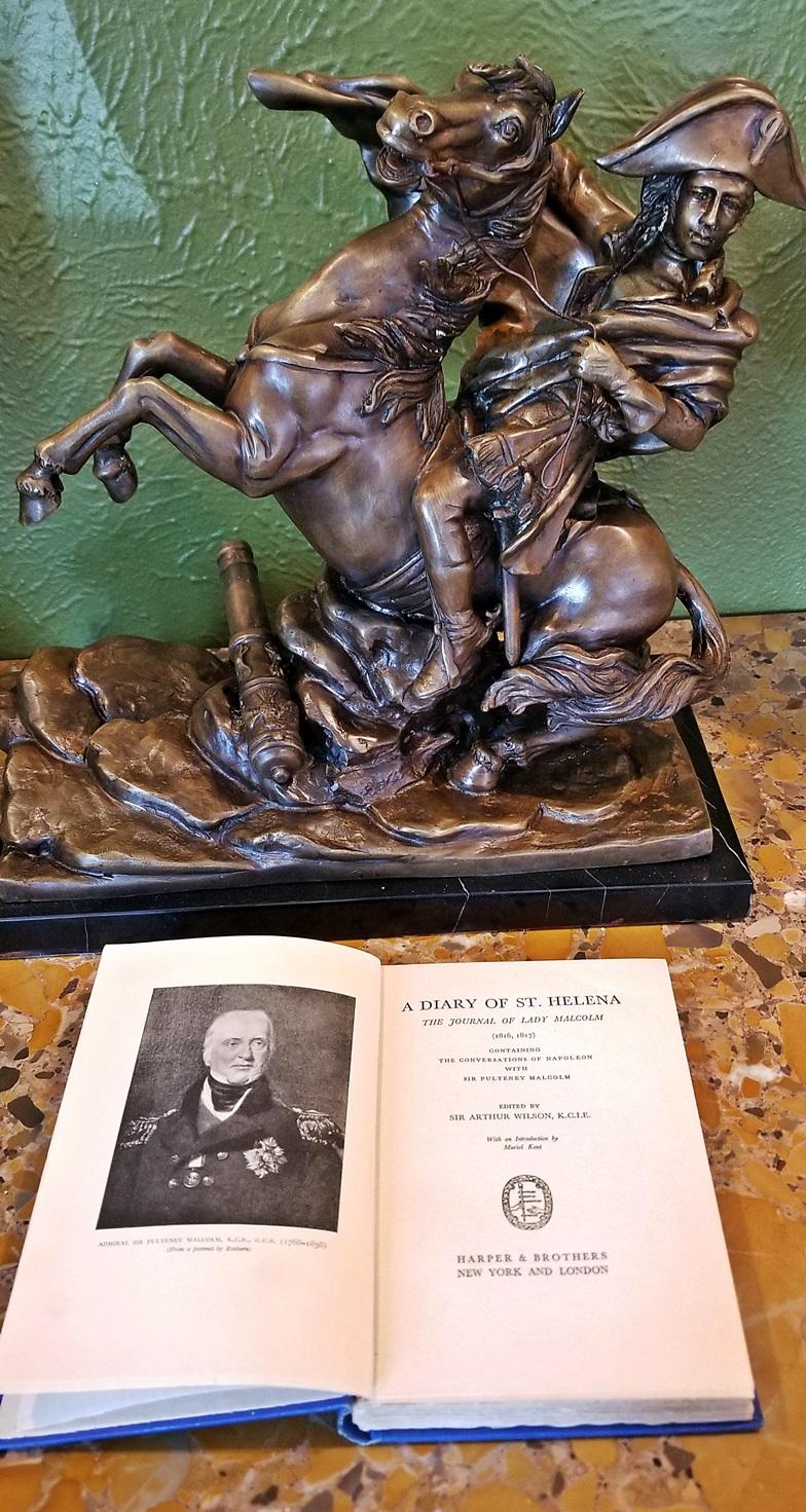 PRESENTING A LOVELY late 19C Bronze Sculpture of Napoleon Crossing the Alps.

19th Century Bronze of Napoleon on Horseback in Battle, with canon, etc at his feet and on his favorite horse, Marengo!

This sculpture is based upon the famous painting