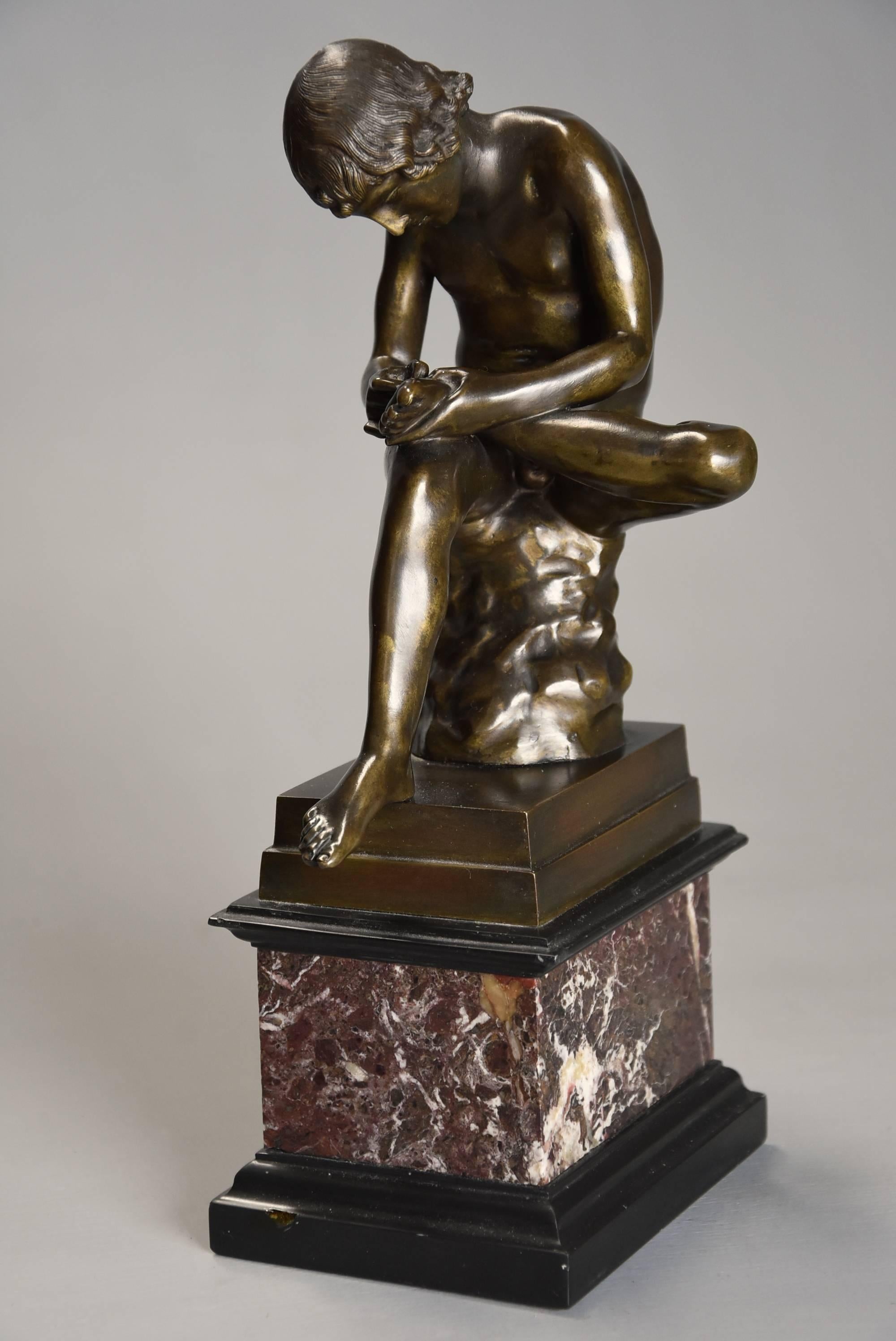 A mid-19th century French bronze figure of 'Spinario' or 'Boy with thorn in his foot', after the Antique with good patina raised on marble base.
 
The original sculpture, of large scale, is a Greco-Roman Hellenistic bronze of a boy withdrawing a
