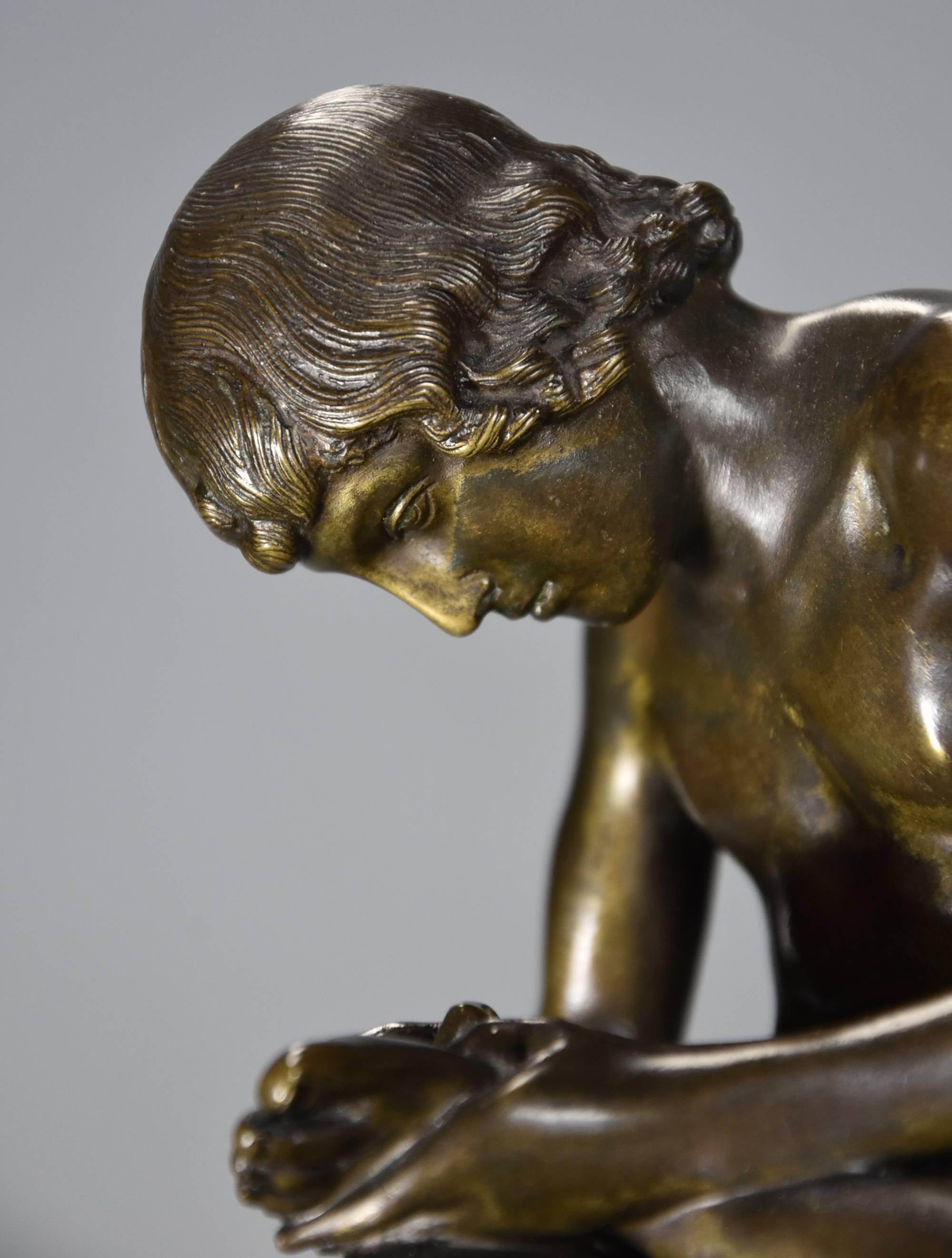 sculpture boy with thorn in foot