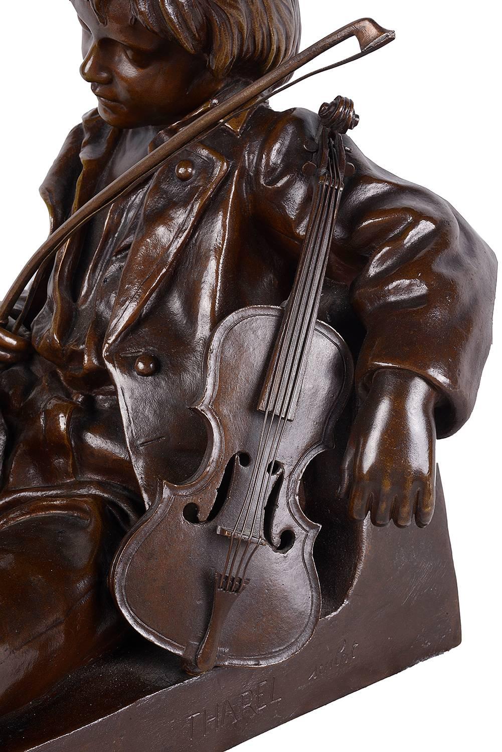 A very good quality 19th century bronze statue of a young boy resting, holding a violin.
Signed;
Leon Tharel (French 1858-1902).