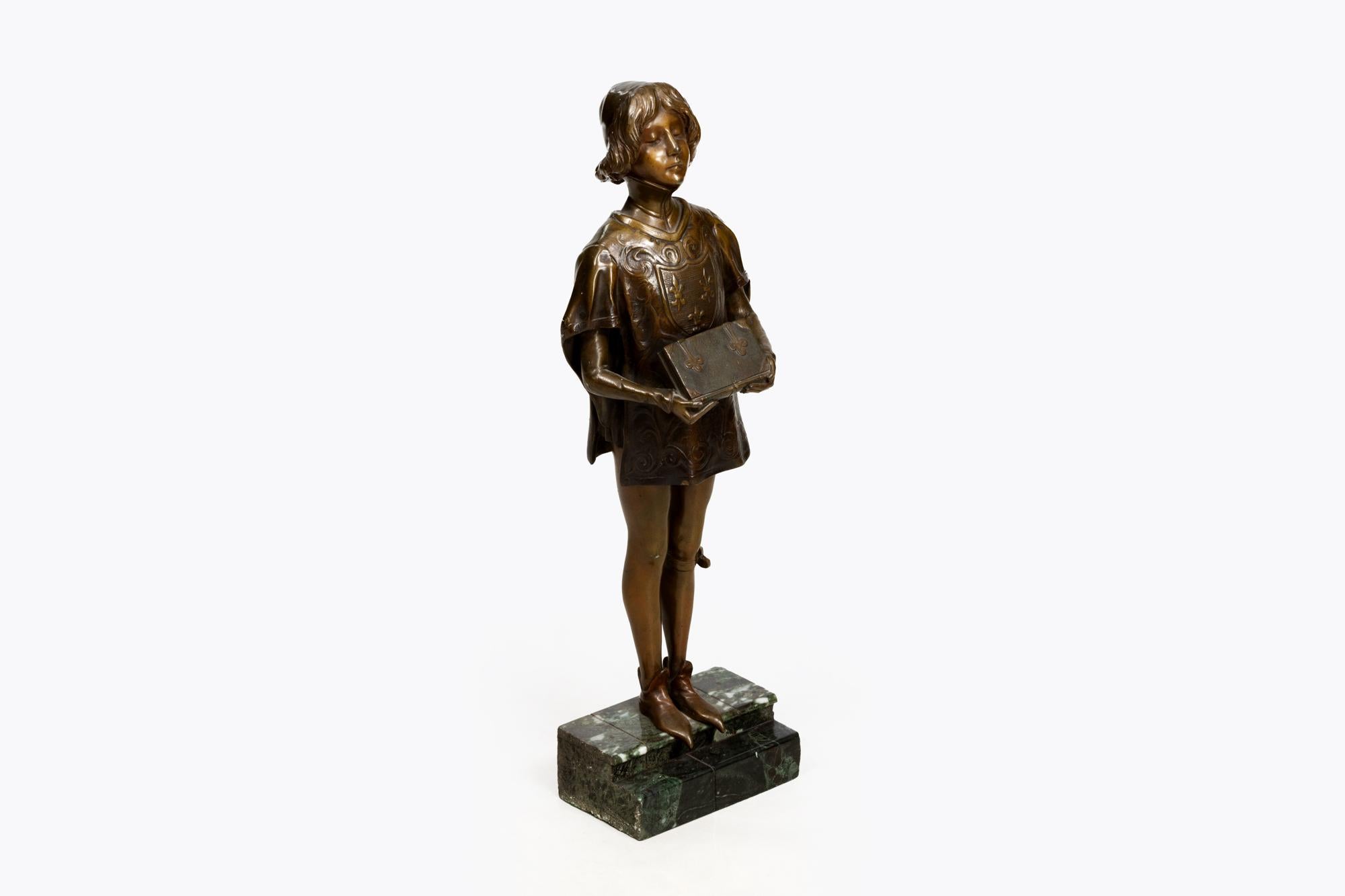 19th Century bronze statue of a medieval page holding a book, it is raised on a stepped rectangular marble plinth.