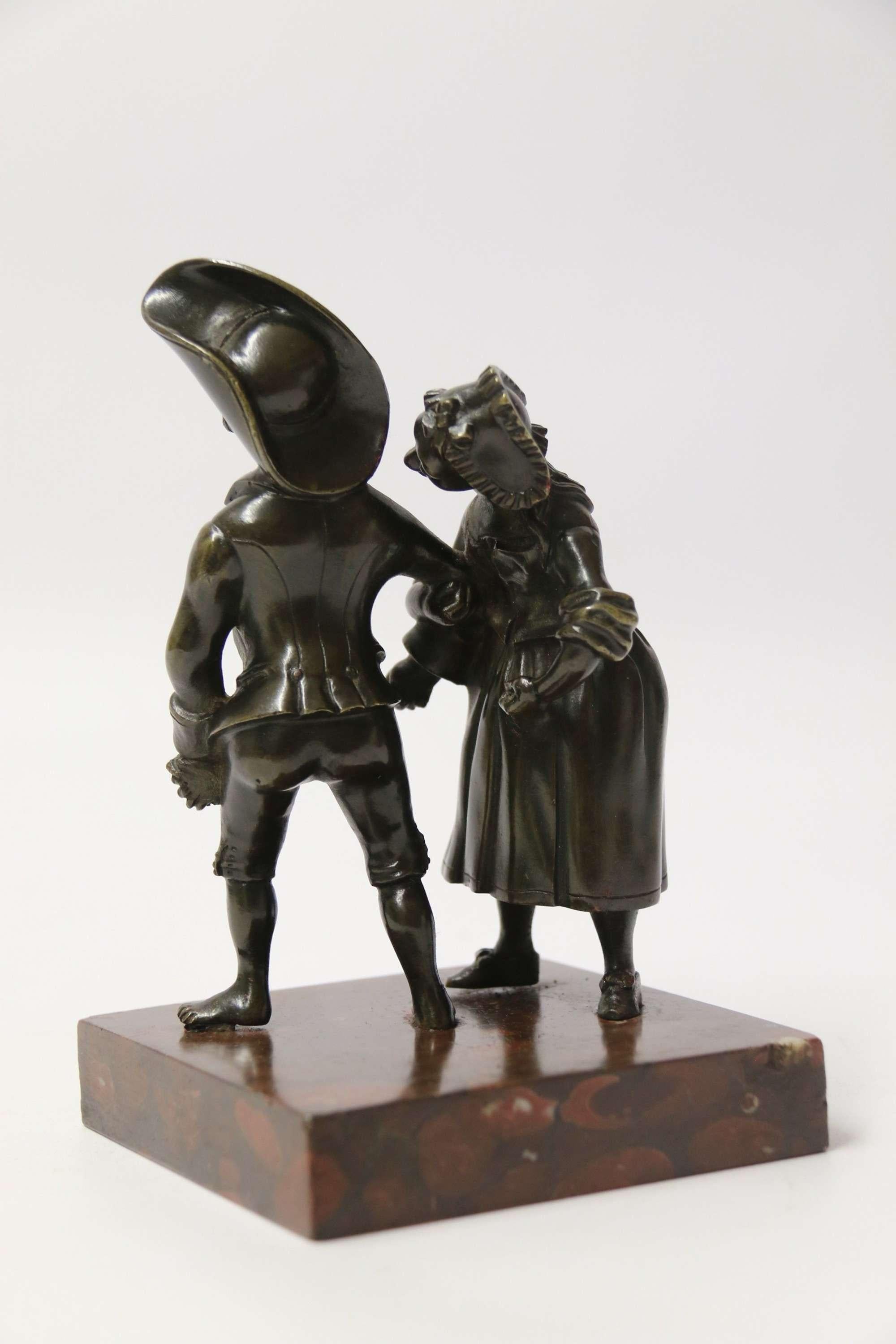 A most amusing 19th C Italian bronze study of a young couple dancing.

This unusual fine quality Italian bronze depicts an 18th-century rural young man and woman dressed typically for the time. Both obviously having had a good time and far too