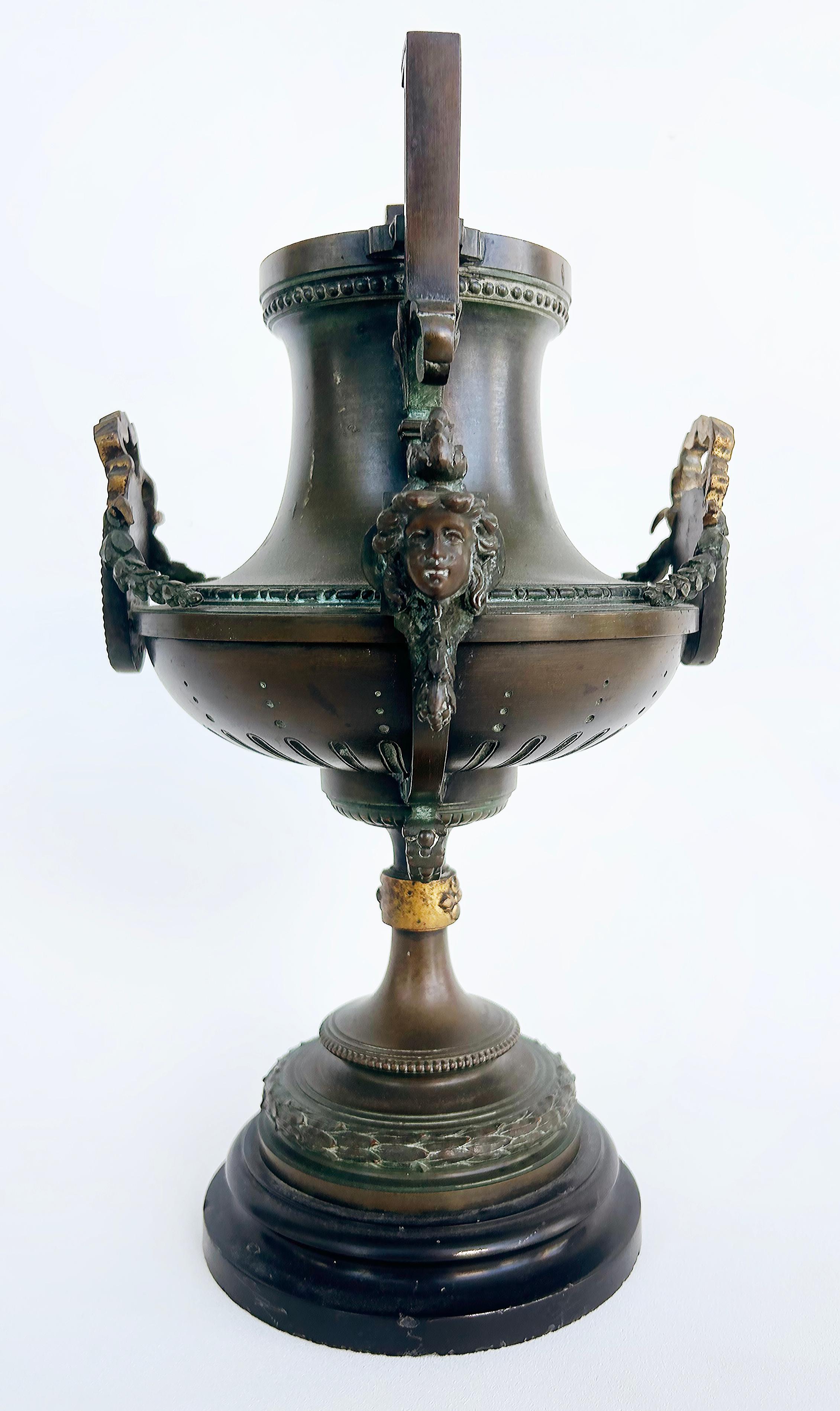 19th Century 19th-Century Bronze Urns with Gilt Cartouches on Stone Bases, Pair For Sale