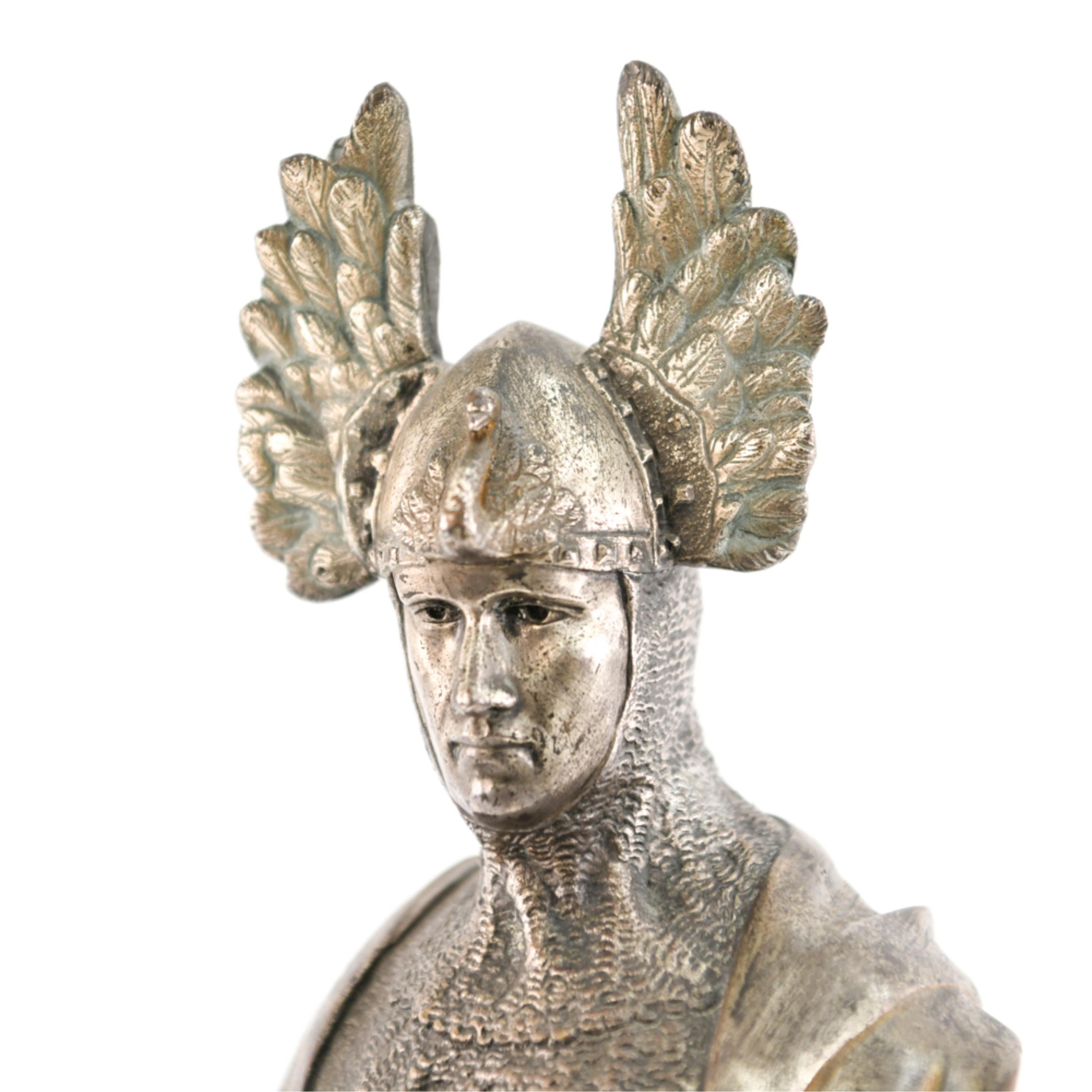 A very commanding appearance, this sculpture will be a focal point displayed in any room. It has a wonderful marble base carved in the manner of a ships bow, this Viking is ready to walk right into battle. Silvered bronze.
