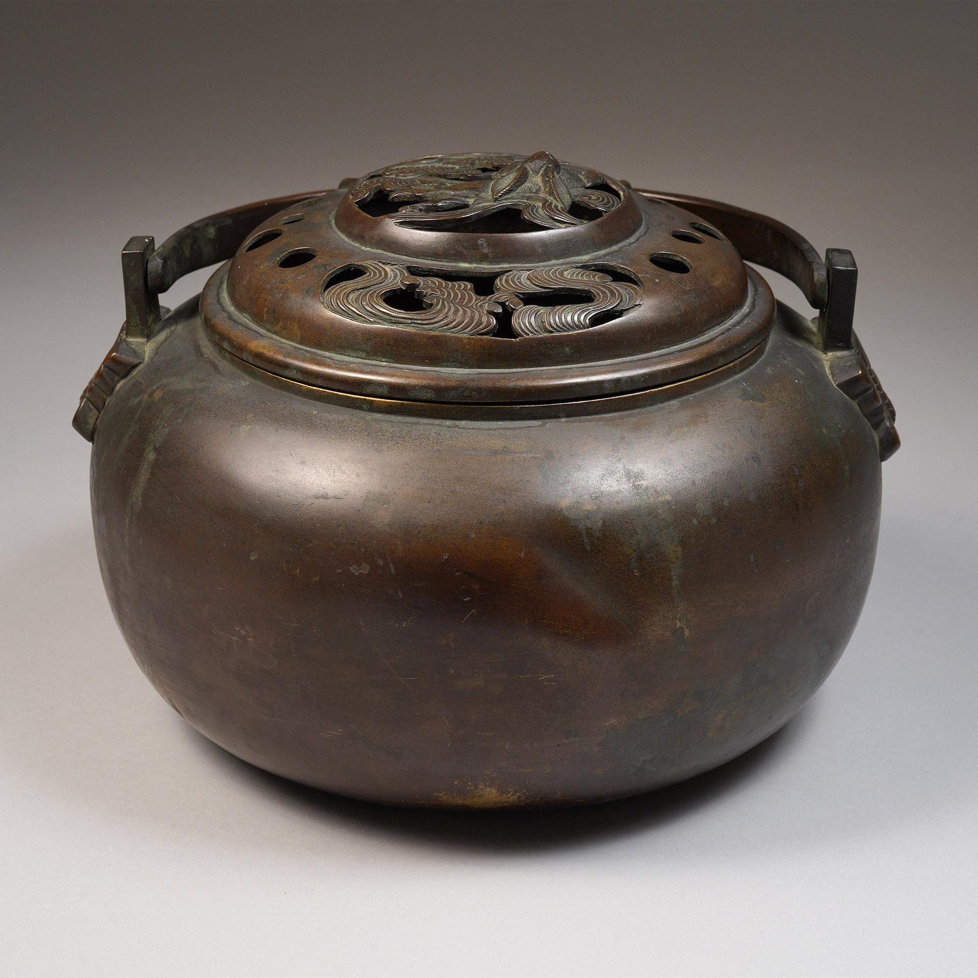 Handwarmer/Censer 
Japan 
circa 19th century
Bronze
Measures: H: 5.5 in x D: 8 in :: 14 cm x 20.3 cm

Happy Tibetan New Year of the Water Rabbit!

The top depicts the Japanese legendary Shiro Usagi (White Rabbit) who cleverly convinced the