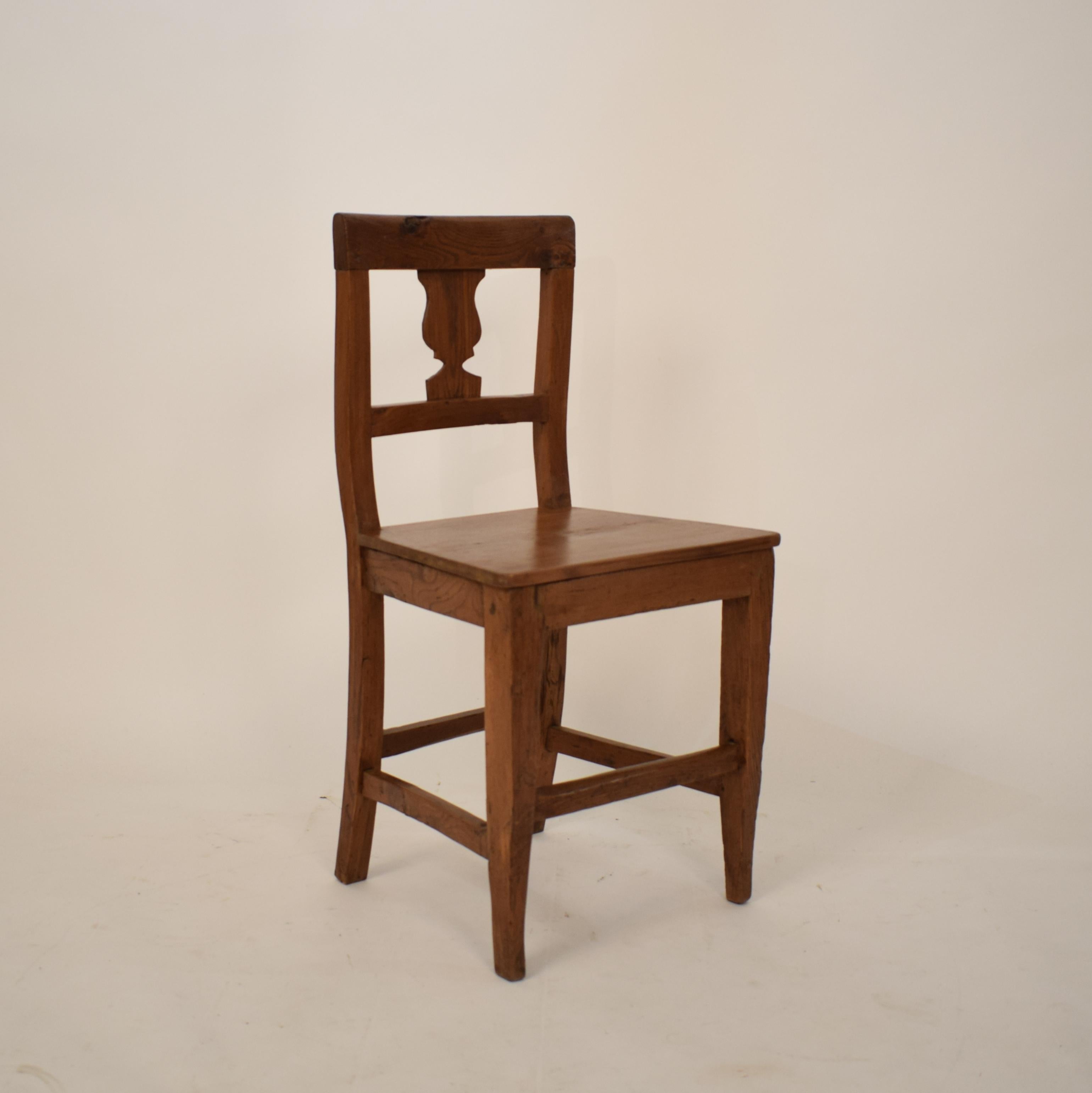 This beautiful 19th century Italian Biedermeier Wabi Sabi side or dining chair was built in 1820. The chair is made out of brown elm and walnut wood.
A unique piece which is a great eyecatcher for your antique, modern, space age or mid-century