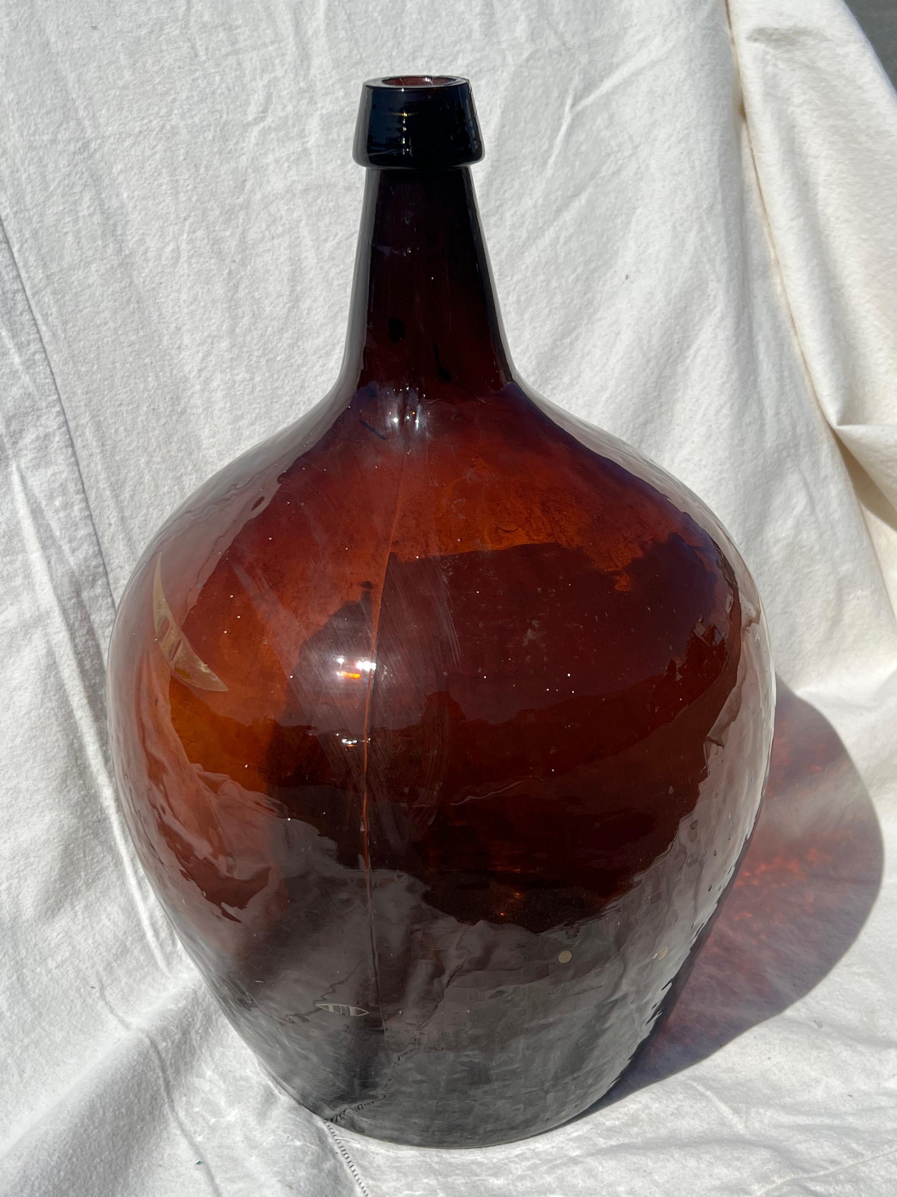 19th Century brown glass demijohn bottle in excellent condition.