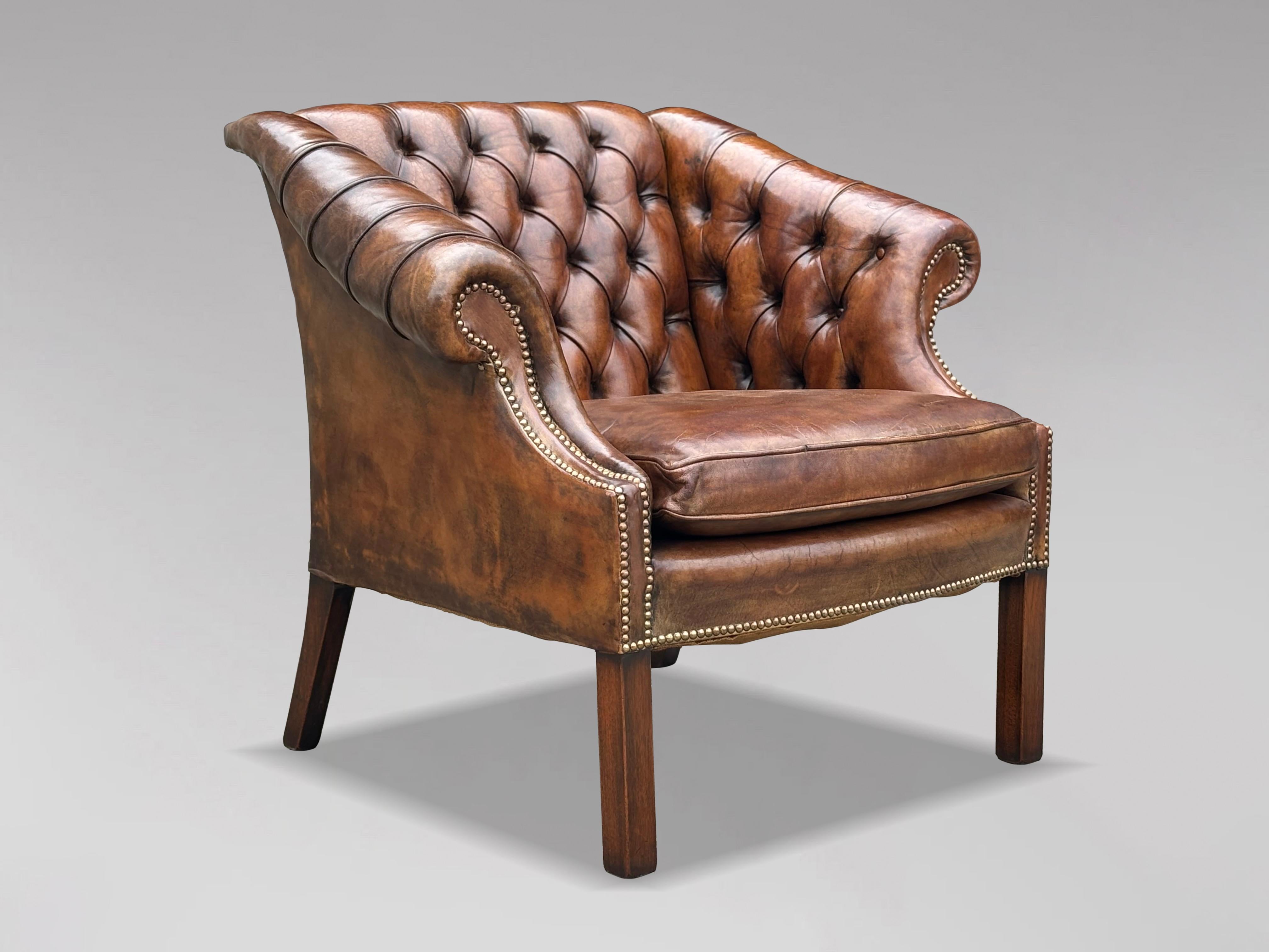 A high-quality, untouched 19th-century brown leather button back club armchair. The substantial, well-shaped frame features a deep-buttoned upholstered back, and arms, all covered in the original brown leather. The chair boasts scrolling arms, a