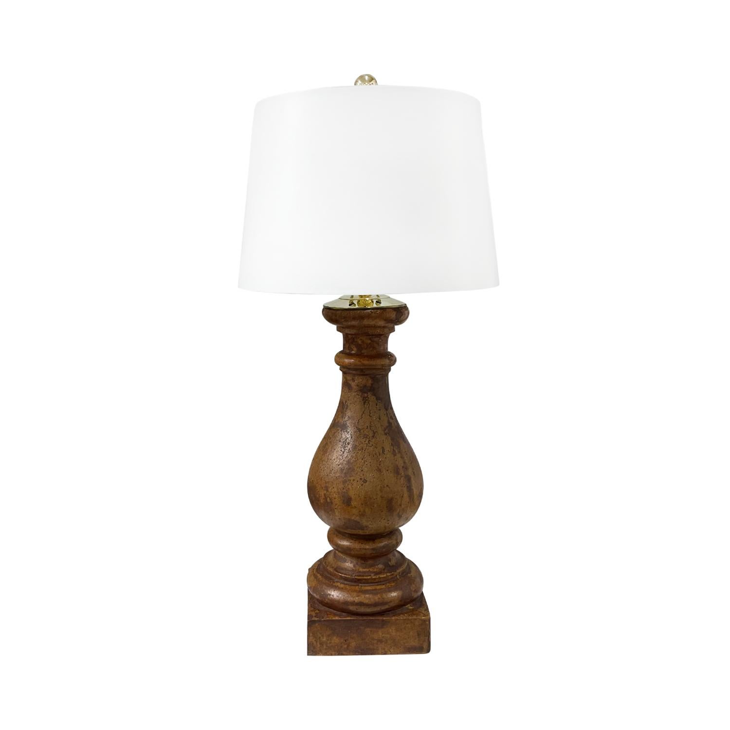 A brown-red, antique French pair of tall table lamps with a new white shade made of hand crafted stone, in good condition. The lights are detailed with a polished brass ring, featuring a one light socket. The wires have been renewed. Wear consistent